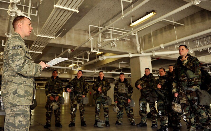U.S. Air Force Senior Airman Kevin Klingelhoefer, 18th Civil Engineer Squadron emergency management, briefs facility set-up during mission assurance command and control rodeo training on Kadena Air Base, Japan, April 16, 2014. The 18th Civil Engineer Group conducts this training to help improve the 18th Wing?s MAC2 proficiency. This training targets those individuals who are new to Kadena or have never gone through an exercise here. (U.S. Air Force photo by Naoto Anazawa)