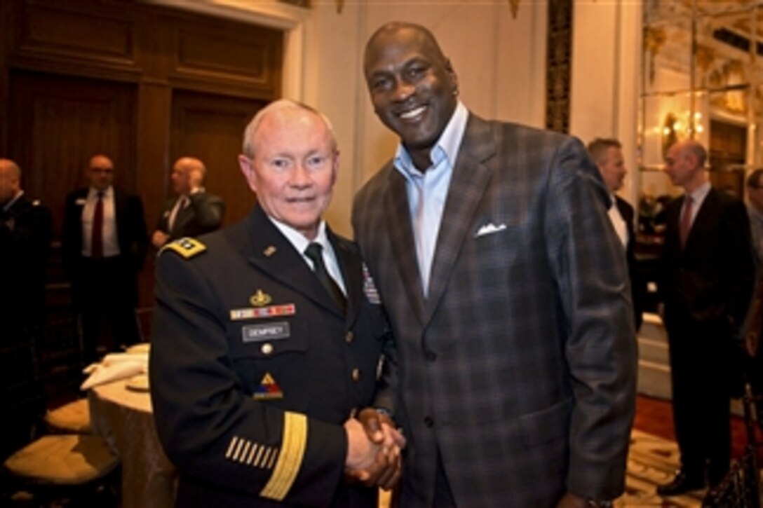 Army Gen. Martin E. Dempsey, chairman of the Joint Chiefs of Staff, and Michael Jordan, former basketball star and majority owner of the Charlotte Bobcats, talk at the National Basketball Association's board of governors meeting in New York, April 17, 2014. During the meeting, Dempsey discussed a new partnership between the NBA and Defense Department to support a commitment to service, calling it a "slam dunk."