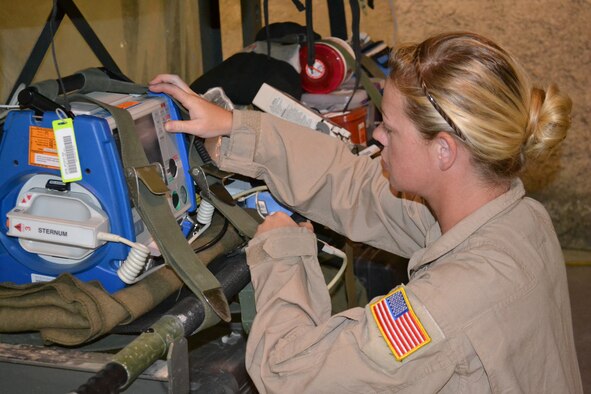 Senior Airman Deonda De Leon, a medical technician with the 379th Expeditionary Aeromedical Evacuation Squadron, inspects a cardiac monitor, performing a function check prior to an AE mission in support of Operation Enduring Freedom, April 16, 2014, Al Udeid Air Base, Qatar.  A crew of two nurses and three medical technicians inspect all emergency equipment litters and medical supplies prior to loading and configuring it on the aircraft to ensure all power operated equipment is running properly and that they have supplies for any and all types of medical emergencies.  De Leon is deployed from Ramstein Air Base, Germany and a native of Vanceburg, Ky.  (U.S. Air Force photo by Maj. Nicole David) 