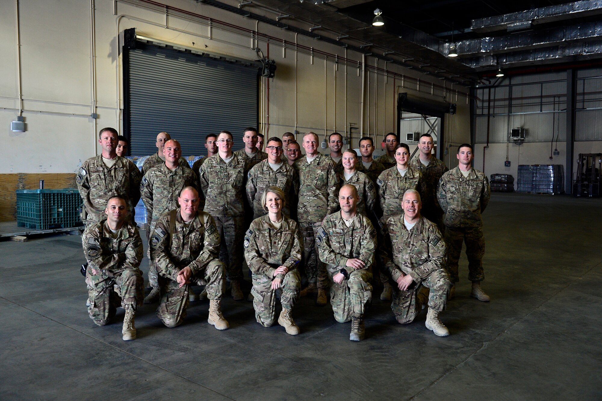 Airmen assigned to the 455th Aerial Port Squadron, pose for a portrait with Chief Master Sgt. of the Air Force James A. Cody during a visit to Bagram Air Field, Afghanistan, April 13, 2014. Cody visited Bagram Air Field during his trip through Afghanistan to encourage, inform and thank Airmen for their hard work supporting Operation Enduring Freedom. His visit to Bagram concluded with a 60-minute question and answer all-call with nearly 500 Airmen. (U.S. Air Force photo by Staff Sgt. Vernon Young Jr.)