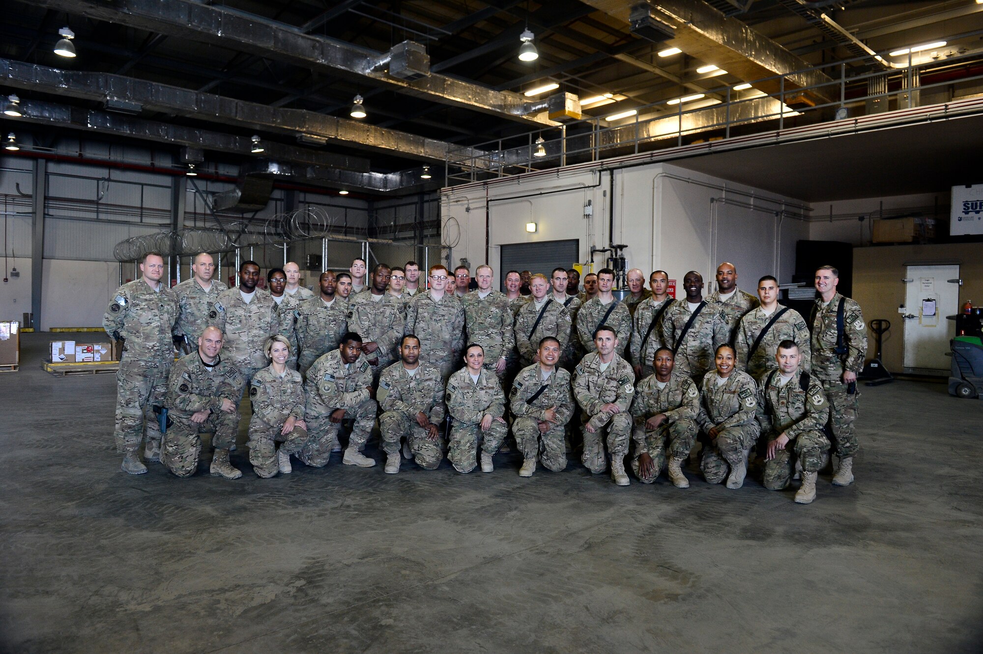 Airmen assigned to the 455th Logistics Readiness Squadron, pose for a portrait with Chief Master Sgt. of the Air Force James A. Cody during his visit to Bagram Air Field, Afghanistan, April 13, 2014. These Airmen are responsible for maintaining military vehicles and their overall readiness. Cody visited Bagram Air Field during his trip through Afghanistan to encourage, inform and thank Airmen for their hard work supporting Operation Enduring Freedom. His visit to Bagram concluded with a 60-minute question and answer all-call with nearly 500 Airmen. (U.S. Air Force photo by Staff Sgt. Vernon Young Jr.)