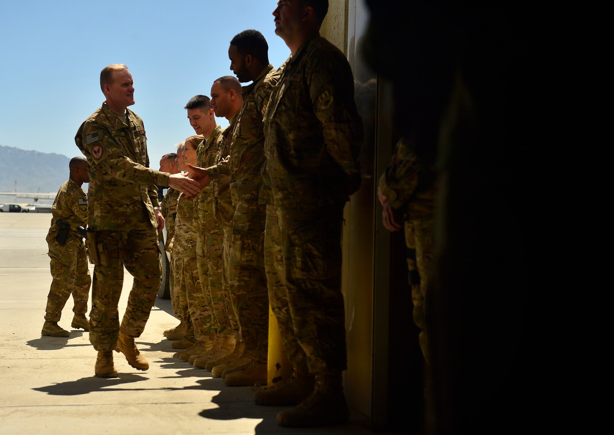 Chief Master Sgt. of the Air Force James Cody shakes hands with 455th Expeditionary Combat Medical Support Squadron Airmen during a visit to Bagram Air Field, Afghanistan, April 13, 2014. Airmen from 4th Expeditionary Rescue Squadron, 83rd Expeditionary Rescue Squadron and 41st Electronic Combat Squadron briefed Cody on their missions. Cody visited Bagram Air Field during his trip through Afghanistan to encourage, inform and thank Airmen for their hard work supporting Operation Enduring Freedom. His visit to Bagram concluded with a 60-minute question and answer all-call with nearly 500 Airmen. (U.S. Air Force photo by Staff Sgt. Vernon Young Jr.)