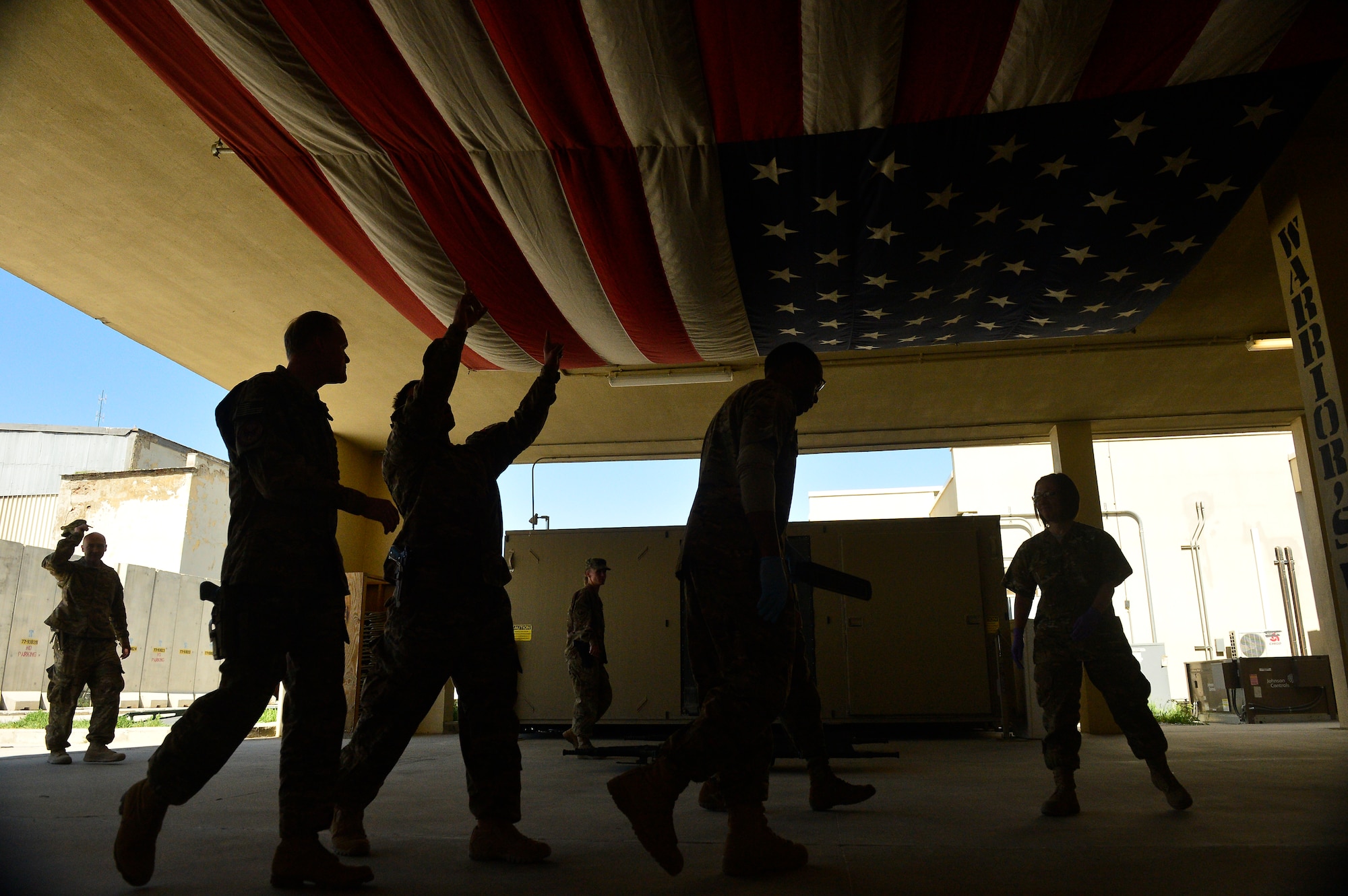 Chief Master Sgt. of the Air Force James Cody, left, receives a briefing as he enters the Craig Joint Theatre Hospital during a visit to Bagram Air Field, Afghanistan, April 13, 2014. The CJTH is home for one of the largest emergency operations, operating rooms and intensive care units in Afghanistan. Cody visited Bagram Air Field during his trip through Afghanistan to encourage, inform and thank Airmen for their hard work supporting Operation Enduring Freedom. His visit to Bagram concluded with a 60-minute question and answer all-call with nearly 500 Airmen. (U.S. Air Force photo by Staff Sgt. Vernon Young Jr.)