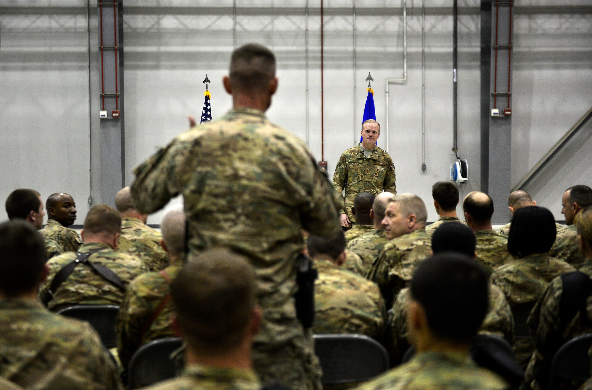 Chief Master Sgt. of the Air Force James A. Cody listens to a question from Chief Master Sgt. Pat Smetzer, 455th Expeditionary Communications Squadron superintendent, during a visit to Bagram Air Field, Afghanistan, April 13, 2014. Cody visited Bagram Air Field during his trip through Afghanistan to encourage, inform and thank Airmen for their hard work supporting Operation Enduring Freedom. His visit to Bagram concluded with a 60-minute question and answer all-call with nearly 500 Airmen. (U.S. Air Force photo by Staff Sgt. Vernon Young Jr.)