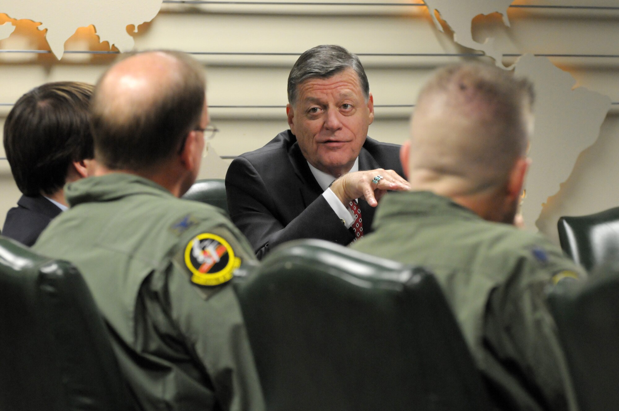 Rep. Tom Cole, R-Okla., talks with Col. David Robertson, the 513th Air Control Group Commander, during a briefing April 18 at Tinker Air Force Base, Okla. During Cole's visit, 513th Airmen explained the Air Force Reserve AWACS mission and the vital role it plays in flying and maintaing the E-3 Sentry Airborne Warning and Control System. (Air Force Photo/Staff Sgt. Caleb J. Wanzer)