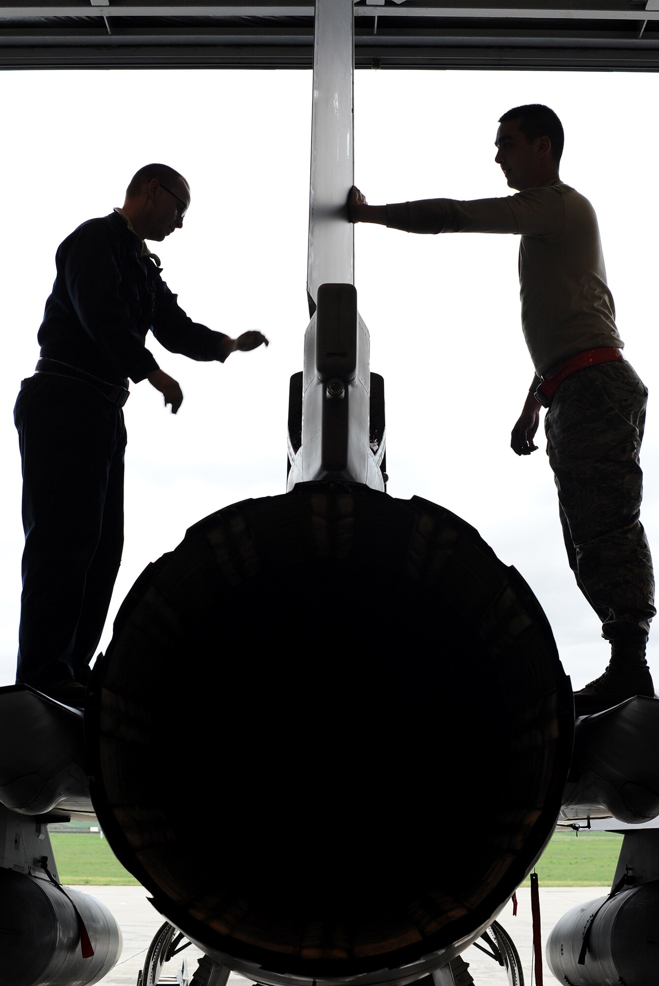 Airmen from the 31st Aircraft Maintenance Squadron hold a new F-16 Fighting Falcon rudder in place before it’s fastened in place at Campia Turzii, Romania, April 16, 2014. A rudder allows an aircraft to turn in flight. (U.S. Air Force photo/Staff Sgt. R.J. Biermann)