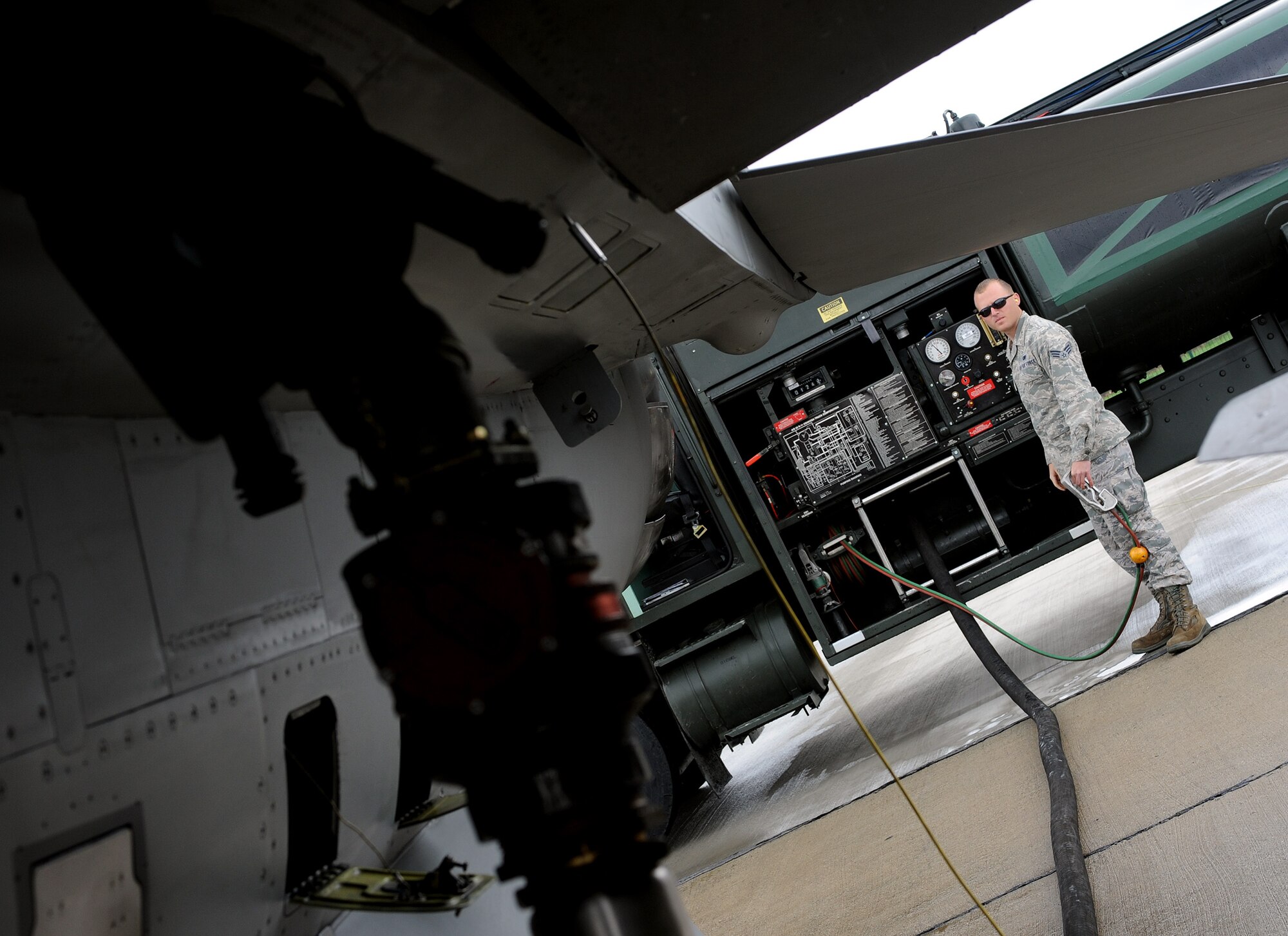 Senior Airman Bryan White, 31st Logistics Readiness Squadron fuels distribution operator, refuels an F-16 Fighting Falcon at Campia Turzii, Romania, April 16, 2014, during Exercise Dacian Viper 2014. The exercise enhanced interoperability and readiness of the U.S. and Romanian air forces. (U.S. Air Force photo/Staff Sgt. R.J. Biermann)