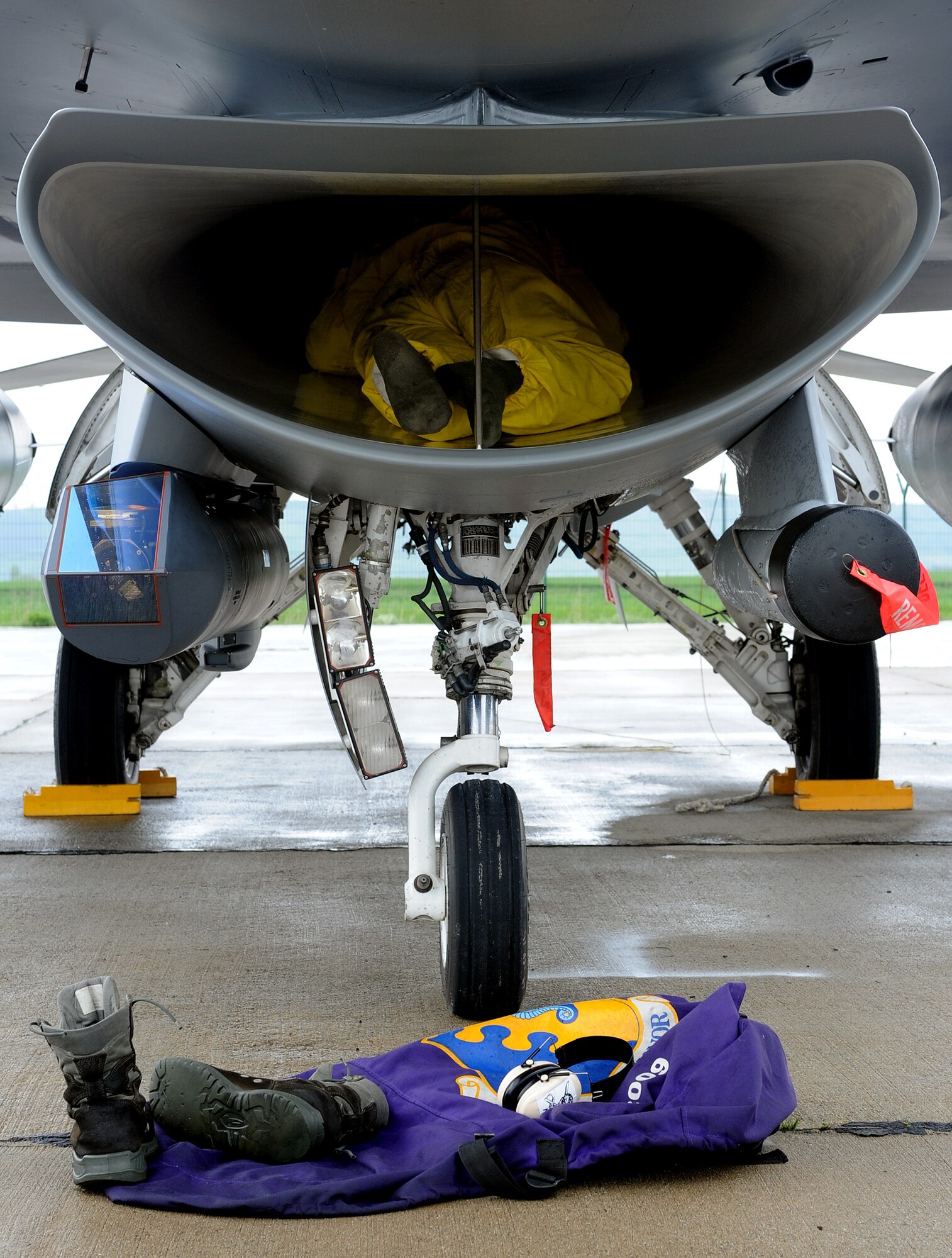 Staff Sgt. Elijah Samala, 31st Aircraft Maintenance Squadron crew chief, checks the intake on an F-16 Fighting Falcon at Campia Turzii, Romania, April 16, 2014, after a flying mission during Exercise Dacian Viper 2014. Crew chiefs check for cracks and oil leaks after each flight to prevent further damage. (U.S. Air Force photo/Staff Sgt. R.J. Biermann)