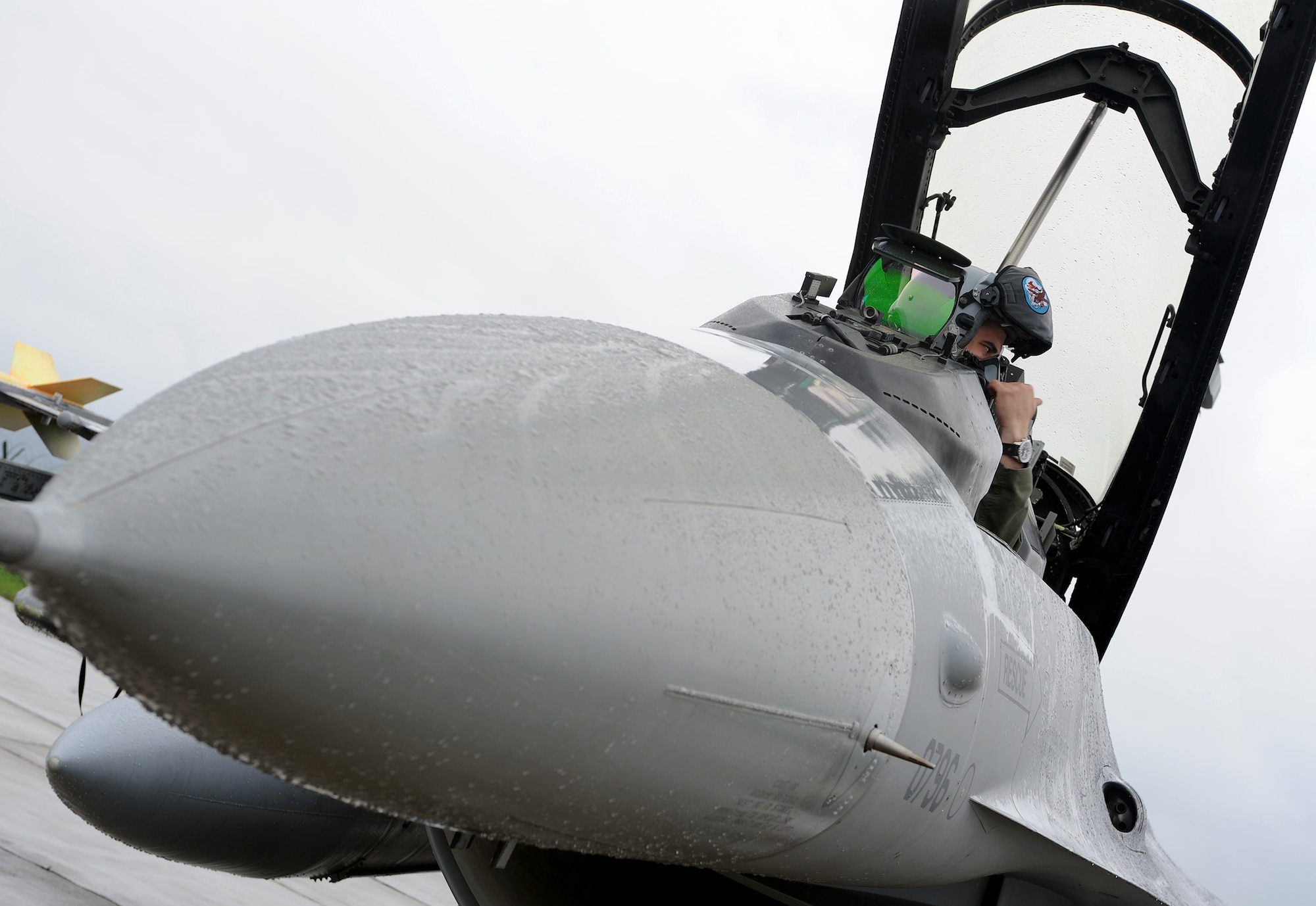Capt. Whit Collins, 510th Fighter Squadron F-16 Fighting Falcon pilot, prepares for his flight at Campia Turzii, Romania, April 16, 2014. Six F-16s from Aviano Air Base, Italy, arrived at Campia Turzii for Exercise Dacian Viper 2014. (U.S. Air Force photo/Staff Sgt. R.J. Biermann)