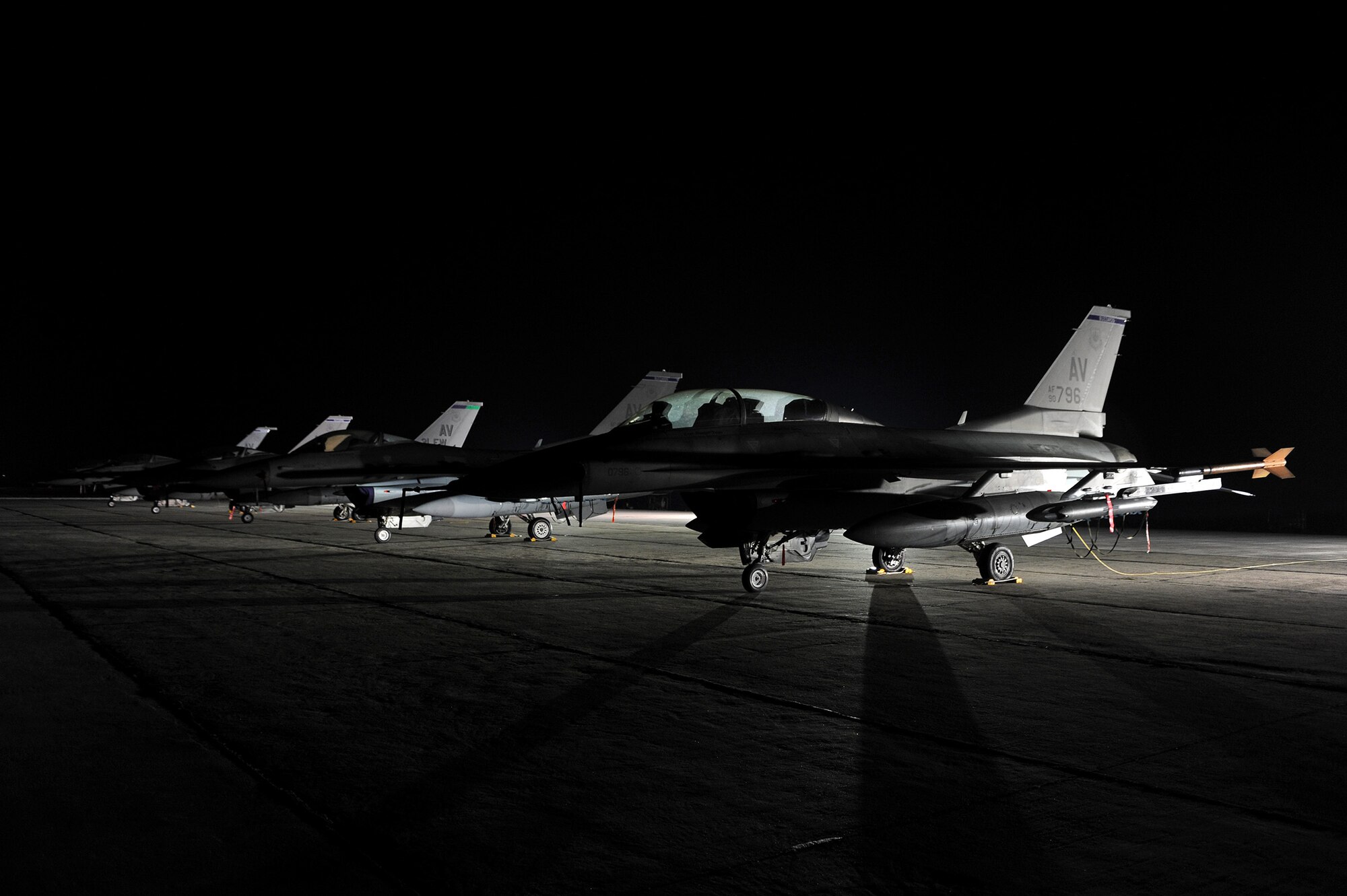 Five F-16 Fighting Falcons sit on the parking apron at Campia Turzii, Romania, April 14, 2014, during Exercise Dacian Viper 2014. U.S. and Romanian air force pilots conducted air-to-air operations during the week-long exercise. (U.S. Air Force photo/Staff Sgt. R.J. Biermann)