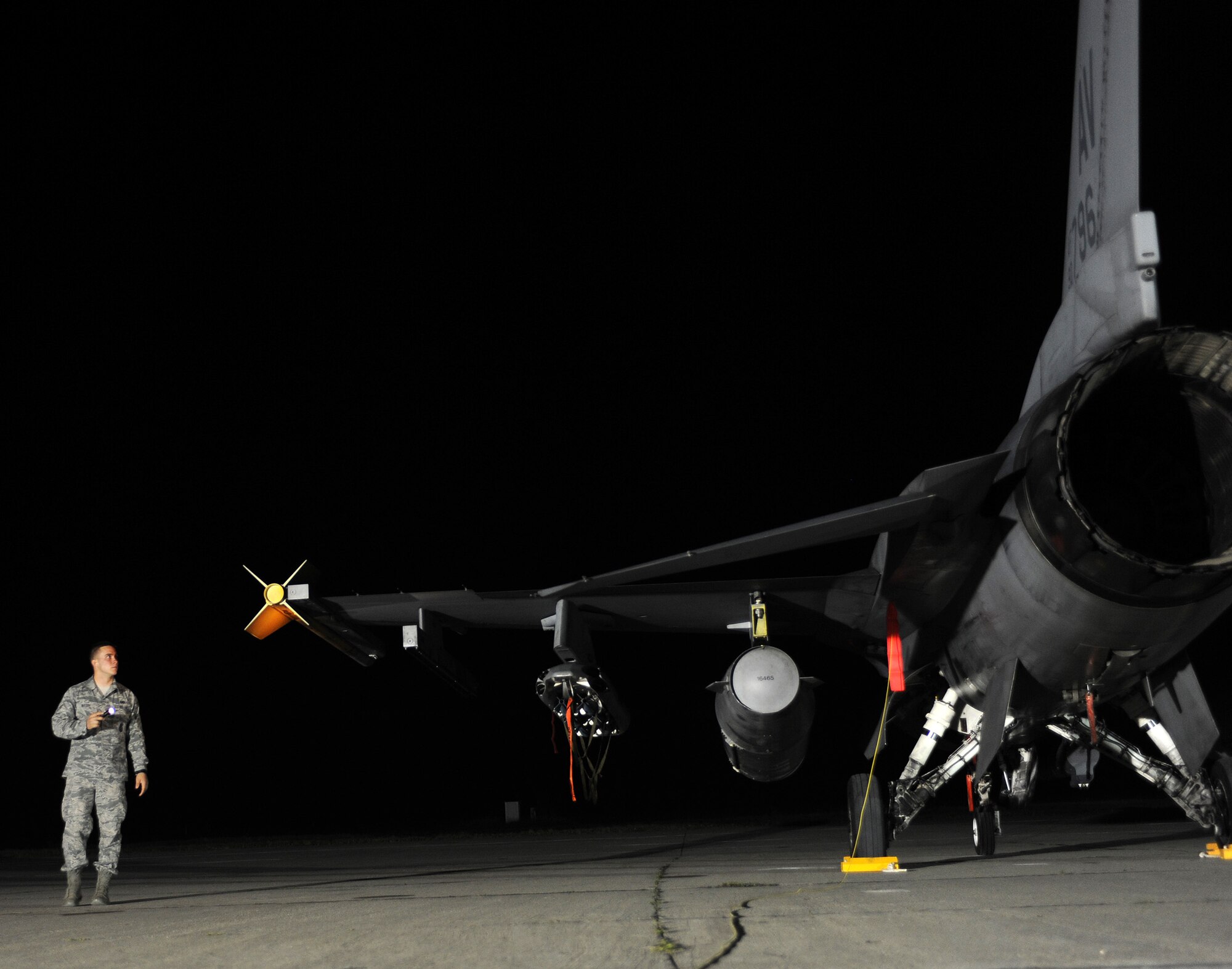 Airman 1st Class Corey Waller, 31st Security Forces Squadron member, provides security for F-16 Fighting Falcons at Campia Turzii, Romania, April 14, 2014. Waller and nearly 150 other Airmen from Aviano Air Base, Italy, visited the 71st Air Base for Exercise Dacian Viper 2014. (U.S. Air Force photo/Staff Sgt. R.J. Biermann)