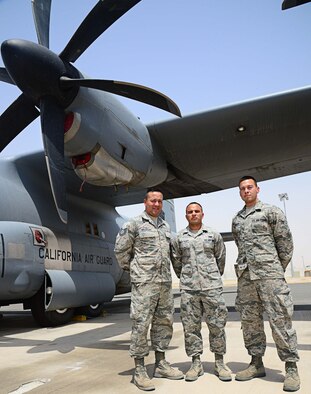 (Left to right) Tech. Sgt. Luis Morales Talento and his little brothers, Senior Airman Walter Morales Talento and Airman 1st Class Guido Morales Talento have been close since growing up in Oxnard, Calif. The Morales Talento brothers are deployed together from the 146th Airlift Wing, Channel Island Air National Guard Station, Calif. Luis is a supply specialist from the 386th Expeditionary Maintenance Group; Walter works at the maintenance operations center controller for the 386th Expeditionary Aircraft Maintenance Squadron;  and Guido is a crew chief with the 386th Expeditionary Aircraft Maintenance Squadron. (U.S. Air Force photo/Senior Airman Desiree W. Moye)