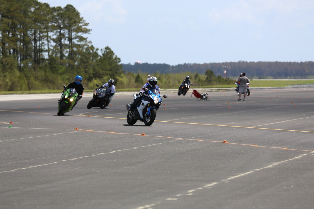 Marine motorcycle riders participate in the Advanced Rider Track Day at Marine Corps Air Station Cherry Point, N.C., April 13, 2014. During the course, Marines of all ranks and ages learned to hone their motorcycle skills by practicing maneuvers such as steering, throttle control and lead angle control. The purpose of ARTD is to empower Marines to be both confident and safe while operating a motorcycle.  