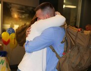 Sgt. Patrick L. Andrews, a flight line mechanic with Marine Heavy Helicopter Squadron (HMH) 464, embraces his wife, Megan R. Andrews, in the lobby of the Albert J. Ellis Airport in Jacksonville, N.C., April 20, 2014, after six months of separation while he was deployed to Okinawa, Japan, with HMH-464. Nine Marines, including Andrews, were part of the advance party’s return from the six-month deployment. (U.S. Marine Corps photo by Sgt. Alicia R. Leaders/Released)