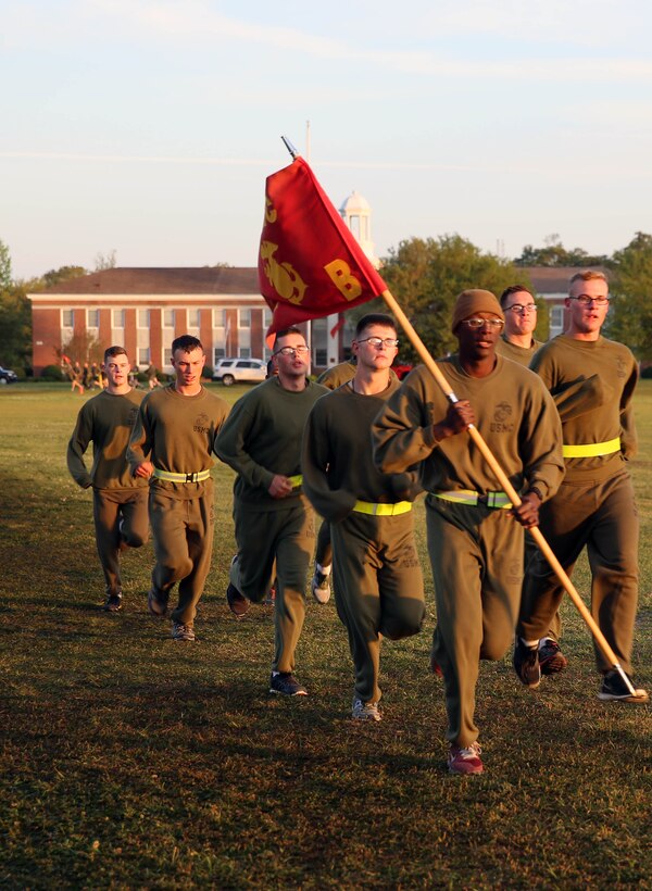 Marines with Bravo Company, 2nd Light Armored Reconnaissance Battalion,  run side-by-side for the second day of the R.A.C.E for Suicide Awareness held at Marine Corps Base Camp Lejeune, NC, April, 17th, 2014. R.A.C.E stands for recognize, act, care and escort, the four terms in helping to prevent a suicide. Runners and personnel involved with the relay hope to ultimately have increased unit cohesion and camaraderie among the division units, and have maximum exposure to various counseling and support services available to service members.