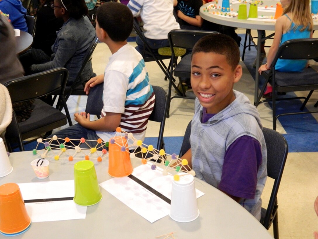 Members of the U.S. Army Corps of Engineers Savannah District hosted a fun activity at E.A. White Elementary School to promote Science, Technology, Engineering and Math (STEM), April 15, 2014. Students in grades 3 – 5 were asked to design and create a bridge to span a 10-inch gap using only toothpicks and gum drops. The final designs were then tested to see which bridge held the most weight. The bridges were weighed down using quarters. The students whose bridges held the most weight from each class were awarded prizes. The sturdiest bridge held 12 quarters. 