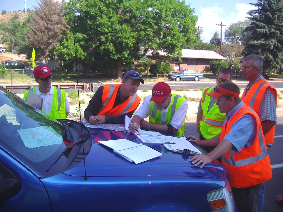 COLORADO SPRINGS, COLO., -- Some of the collaboration among Corps, local and state officials during an inspection of infrastructure during the Waldo Canyon Post Fire. Photo by Cheryl Buckel, July 10, 2012.      