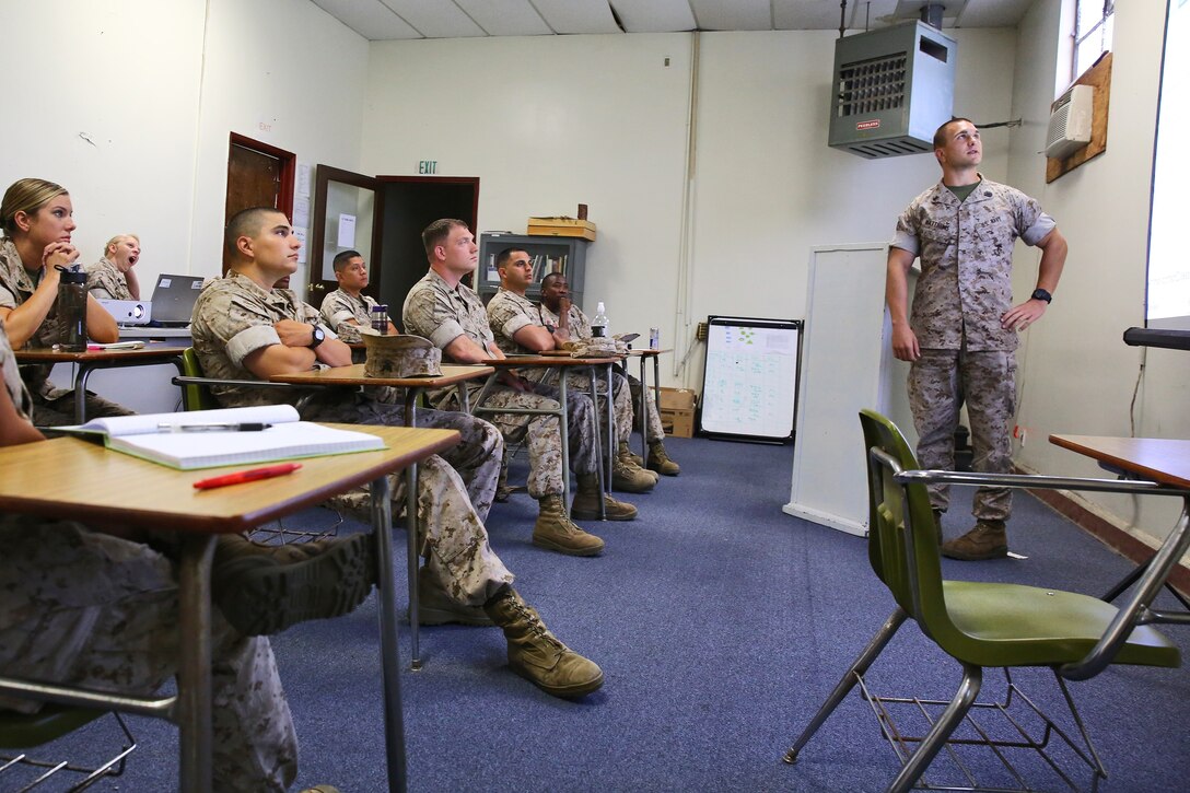 Petty Officer 2nd Class Michael L. Matthews, corpsman, Preventative Medicine Unit, 1st Medical Battalion, 1st Marine Logistics Group, teaches an Operational Preventative Medicine course aboard Camp Pendleton, Calif., April 16, 2014. The day-long class teaches corpsmen measures of preventative care they should consider when planning and conducting operations around the globe. Ten levels of preventative care are taught during the course, including medical intelligence, camp layout, hygiene, habitability, pest management, inspections and reports, waste disposal, water sanitation, disease tracking and food preparation and sanitation.