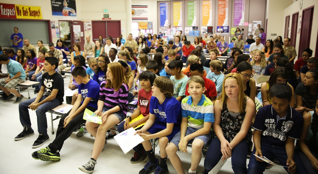 Condor Elementary School staff and teachers honored students kindergarten through sixth grade with performance and achievement awards during a ceremony at the school, April 11, 2014. Awards are presented to the students every trimester, and range from various accomplishments including honor roll, writing, perfect attendance, personal success, respect and more. (Official Marine Corps Photo By Lance Cpl. Kasey Peacock/Released)