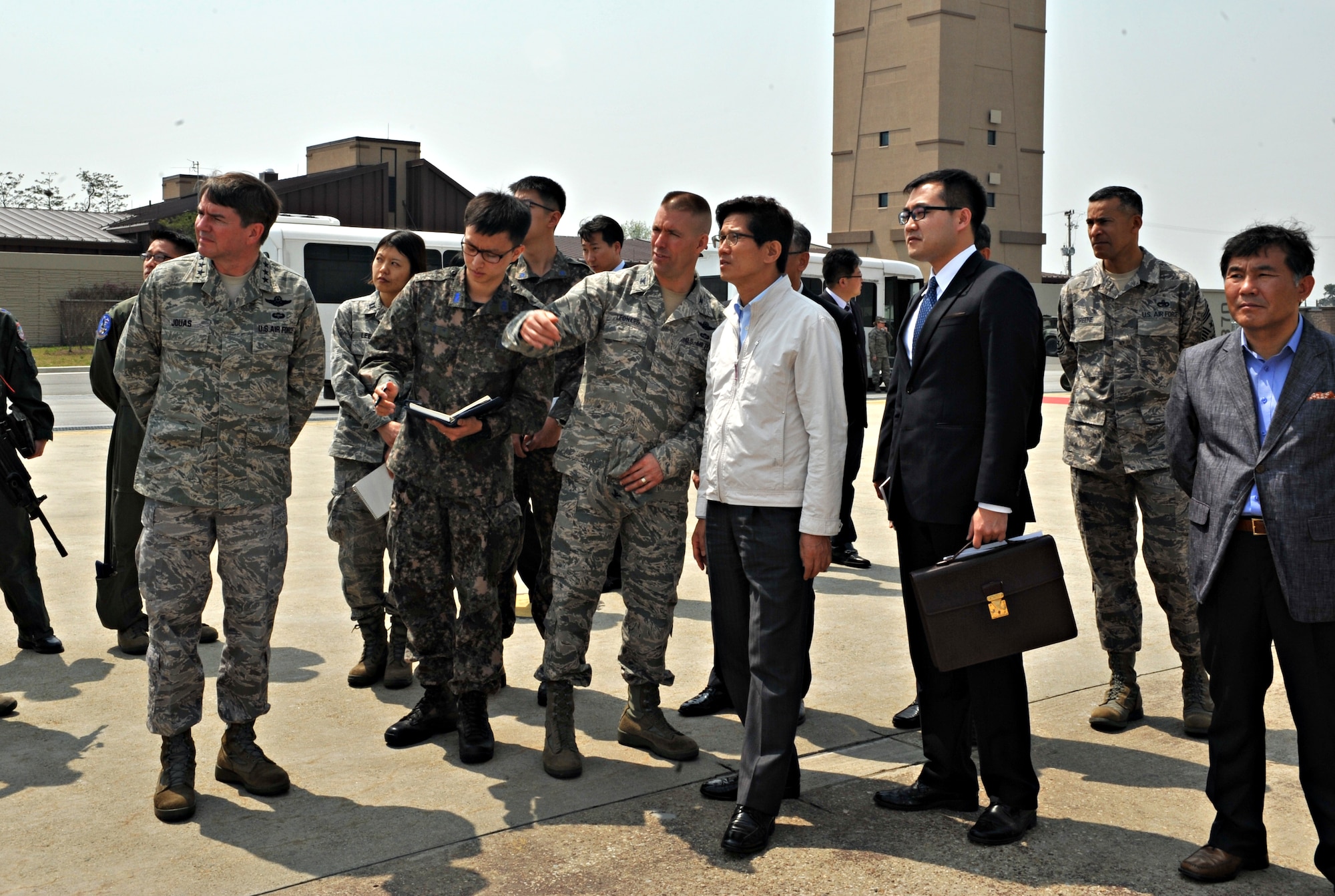 Col. Brook Leonard, 51st Fighter Wing commander, discusses the different aircraft at Osan with Moon-soo Kim, Gyeonggi-do province governor, during a visit to Osan Air Base, Republic of Korea, April 21, 2014. Leonard, Lt. Gen. Jan-Marc Jouas, 7th Air Force commander, Chief Master Sgt. Terrence Greene, 51st FW command chief, and pilots from the 25th and 36th Fighter and 5th Reconnaissance Squadrons explained the base’s airpower capability. (U.S. Air Force photo/Airman 1st Class Ashley J. Thum)