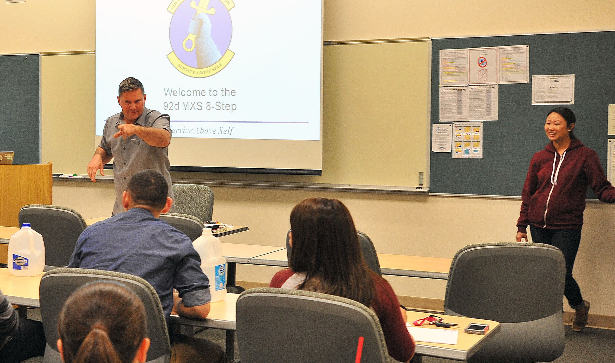 Maj. Sean Goode briefs Airmen from the squadron before an Air Force Smart Operations for the 21st century event where the Airmen learned to apply eight-step process to promote awareness of underage drinking, April 15, 2014, at Fairchild Air Force Base, Wash. The AFSO21 principles and tools enable Airmen to change the day-to-day operating style to integrate continuous improvement into the full spectrum of Air Force operations, and can be applied to any aspect of the mission. Goode is the 92nd Maintenance Squadron commander. (U.S. Air Force photo by Staff Sgt. Veronica Montes/Released)