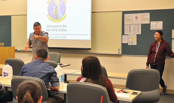 Maj. Sean Goode briefs Airmen from the squadron before an Air Force Smart Operations for the 21st century event where the Airmen learned to apply eight-step process to promote awareness of underage drinking, April 15, 2014, at Fairchild Air Force Base, Wash. The AFSO21 principles and tools enable Airmen to change the day-to-day operating style to integrate continuous improvement into the full spectrum of Air Force operations, and can be applied to any aspect of the mission. Goode is the 92nd Maintenance Squadron commander. (U.S. Air Force photo by Staff Sgt. Veronica Montes/Released)