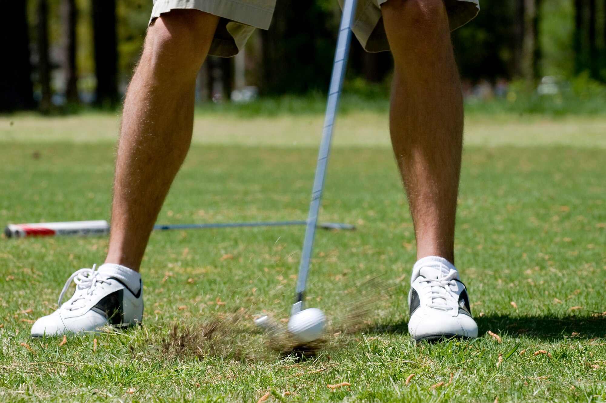 Senior Airman Nathan Ferrier, 4th Component Maintenance Squadron precision measurement equipment laboratory technician, hits an approach shot during the Sexual Assault Prevention and Response Program golf tournament, April 17, 2014, at Seymour Johnson Air Force Base, N.C. The event was held in support of Sexual Assault Awareness Month. Congratulations to Master Sgt. Steven Shiflett, 414th Aircraft Maintenance Squadron electrical and environmental systems technician, Tech. Sgt. William Doulin, 4th Component Maintenance Squadron electrical and environmental systems technician, and Staff Sgts. Joseph Shearin and Adam Mitchell, 4th CMS electrical and environmental systems technicians, for winning the tournament with a score of -7. (U.S. Air Force photo/Airman 1st Class Aaron J. Jenne)