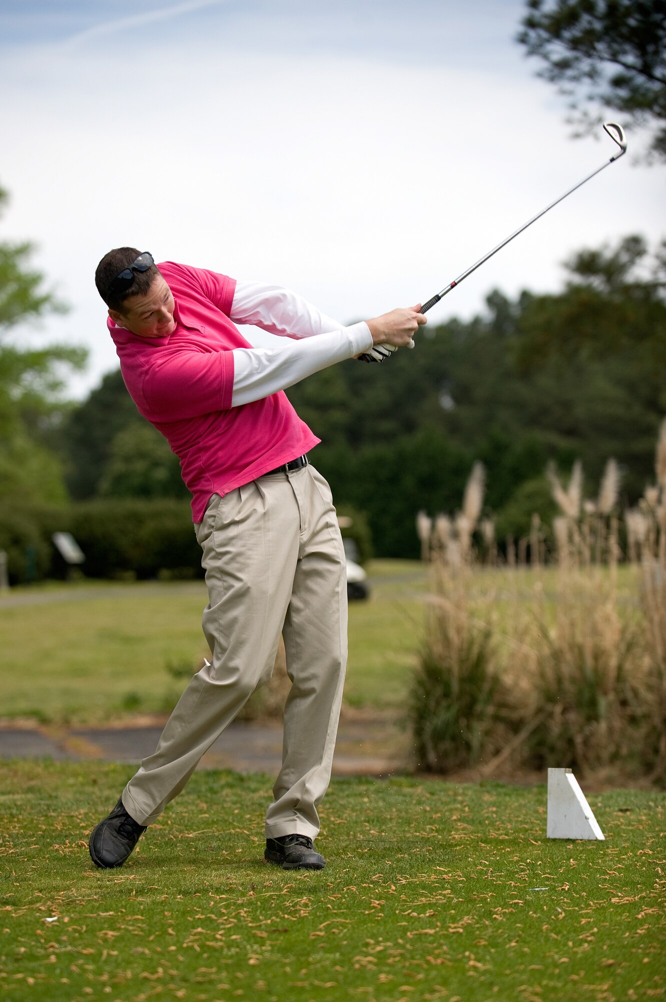 Airman 1st Class Brittain Crolley, 4th Fighter Wing Public Affairs photojournalist, tees off during the Sexual Assault Prevention and Response Program golf tournament, April 17, 2014, at Seymour Johnson Air Force Base, N.C. The tournament was one of six events held in conjunction with Sexual Assault Awareness Month, including a 5K run, two screenings of “The Invisible War” and a SAPR Stand-down Day scheduled for April 25. Congratulations to Master Sgt. Steven Shiflett, 414th Aircraft Maintenance Squadron electrical and environmental systems technician, Tech. Sgt. William Doulin, 4th Component Maintenance Squadron electrical and environmental systems technician, and Staff Sgts. Joseph Shearin and Adam Mitchell, 4th CMS electrical and environmental systems technicians, for winning the tournament with a score of -7. (U.S. Air Force photo/Airman 1st Class Aaron J. Jenne)