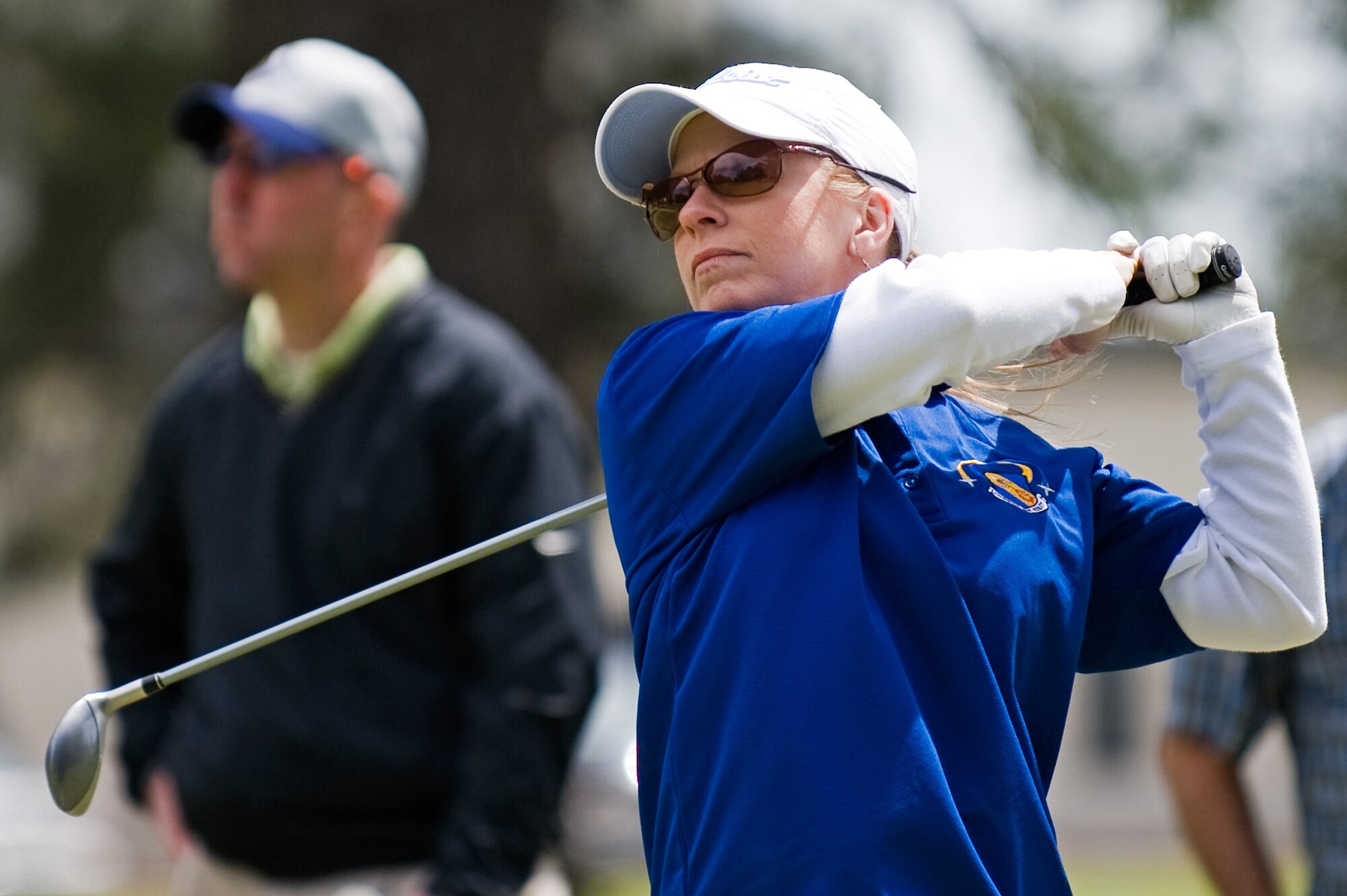 Elizabeth McKenzie, 4th Fighter Wing commander’s secretary, hits an approach shot during the Sexual Assault Prevention and Response Program golf tournament, April 17, 2014, at Seymour Johnson Air Force Base, N.C. Seventeen teams competed during the tournament, which was held in conjunction with Sexual Assault Awareness Month. Congratulations to Master Sgt. Steven Shiflett, 414th Aircraft Maintenance Squadron electrical and environmental systems technician, Tech. Sgt. William Doulin, 4th Component Maintenance Squadron electrical and environmental systems technician, and Staff Sgts. Joseph Shearin and Adam Mitchell, 4th CMS electrical and environmental systems technicians, for winning the tournament with a score of -7. (U.S. Air Force photo/Airman 1st Class Aaron J. Jenne)