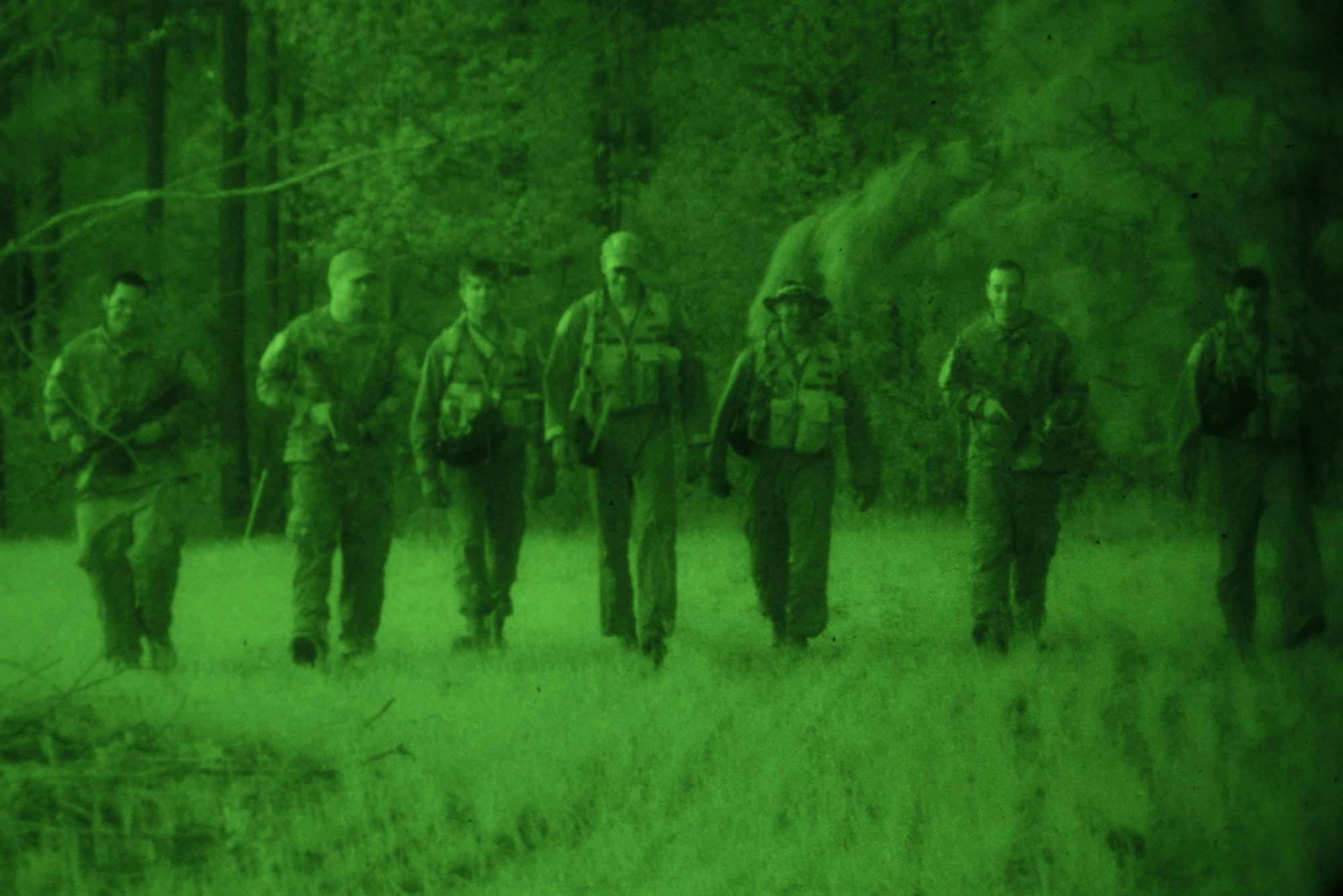 U.S. Air Force Airmen are rescued by simulated U.S. forces and brought to safety in a survival, evasion, resistance, escape training scenario at Poinsett Range near Wedgefield, S.C., April 16, 2014. The Airmen effectively evaded the simulated enemy forces and learned different techniques on how to stay hidden in broad daylight and twilight, as well as how to stay alive during different weather conditions. (U.S. Air Force photo by Airman 1st Class Diana M. Cossaboom/Released)