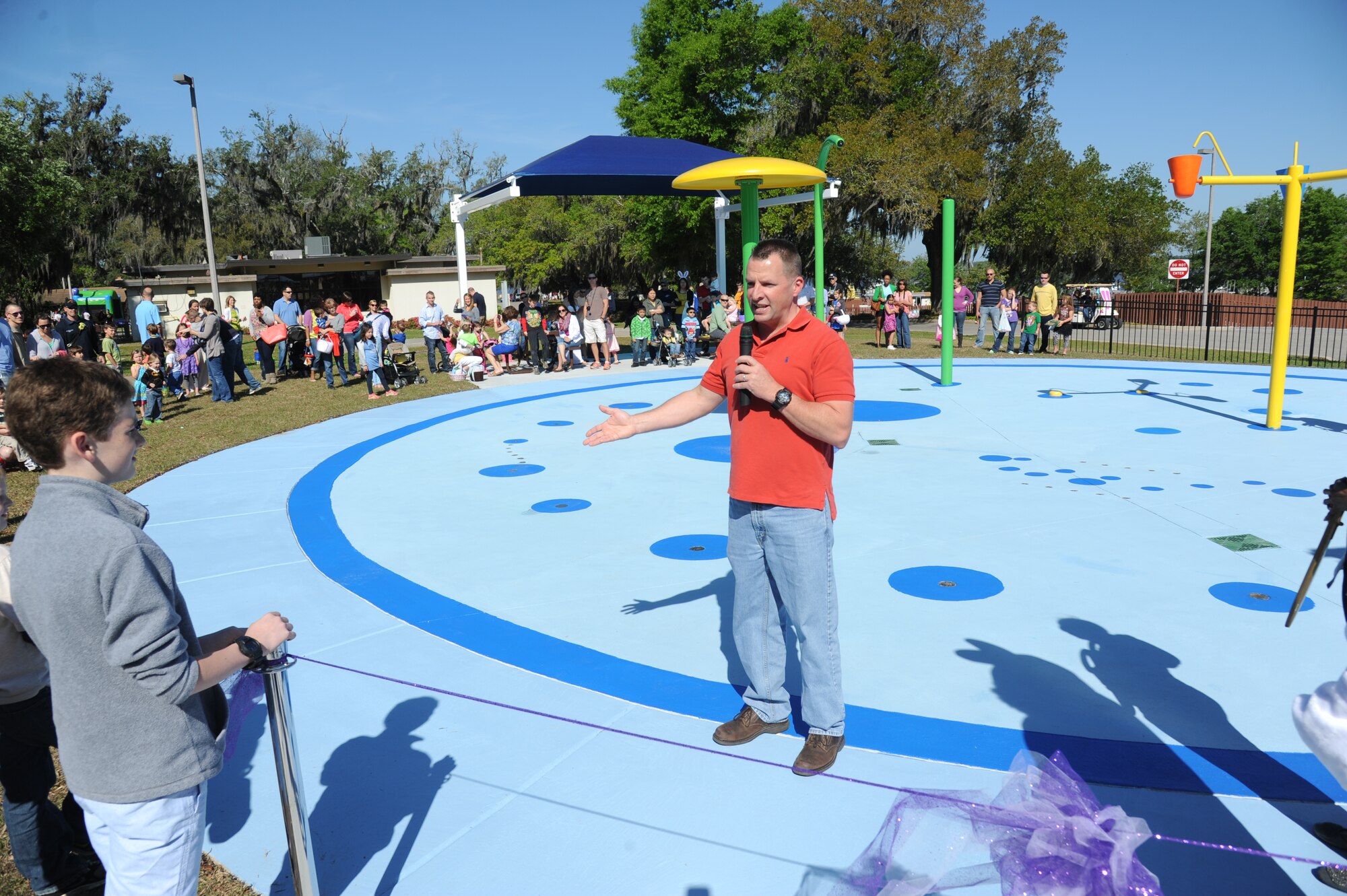 Brig. Gen. Patrick Higby, 81st Training wing commander, welcomes the crowd to the Keesler Outdoor Recreation’s Splash Pad grand opening at the marina April 19, 2014, at Keesler Air Force Base, Miss.  The splash pad was funded with a portion of the 2013 Commander-in-Chief Installation Excellence award funds.  (U.S. Air Force photo by Kemberly Groue)