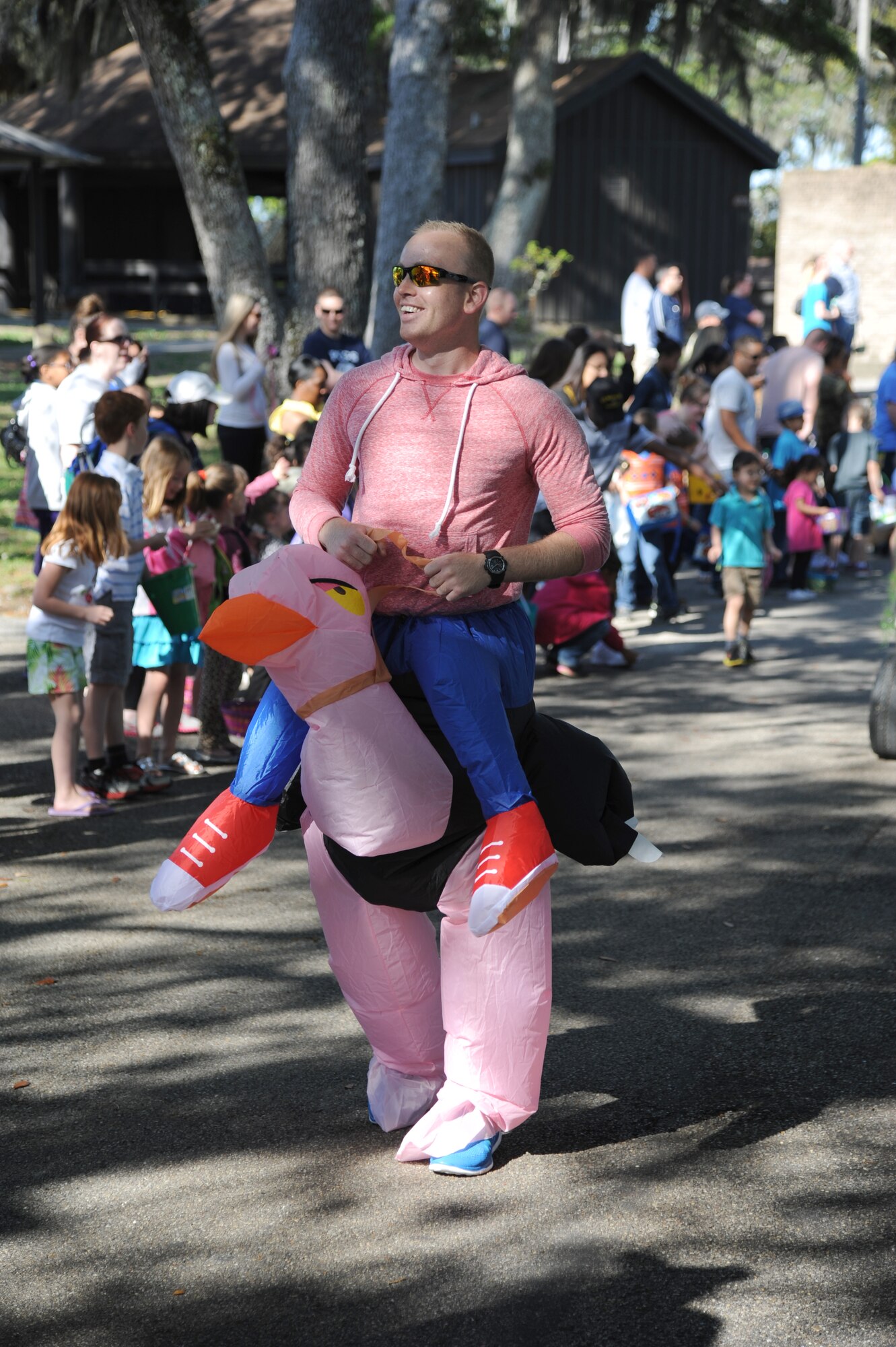 Airman 1st Class Nathan Tothero, 338th Training Squadron, participates in the Keesler Easter parade while dressed as an ostrich April 19, 2014, at the marina, Keesler Air Force Base, Miss.  The parade was followed by an Easter egg hunt and the grand opening of the outdoor recreation’s splash pad.  (U.S. Air Force photo by Kemberly Groue)