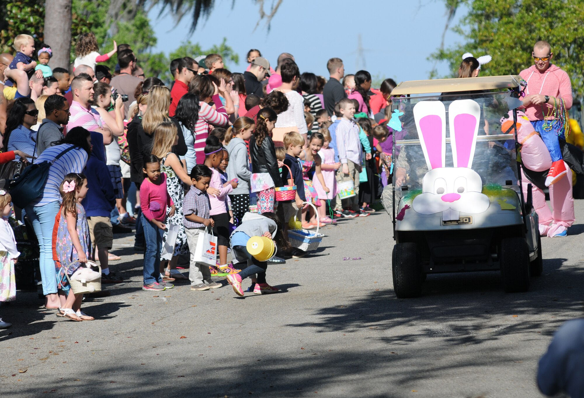 Decorated golf carts roll through the Keesler Marina during an Easter parade April 19, 2014, at Keesler Air Force Base, Miss.  The parade was followed by an Easter egg hunt and the grand opening of the outdoor recreation’s splash pad.  (U.S. Air Force photo by Kemberly Groue)
