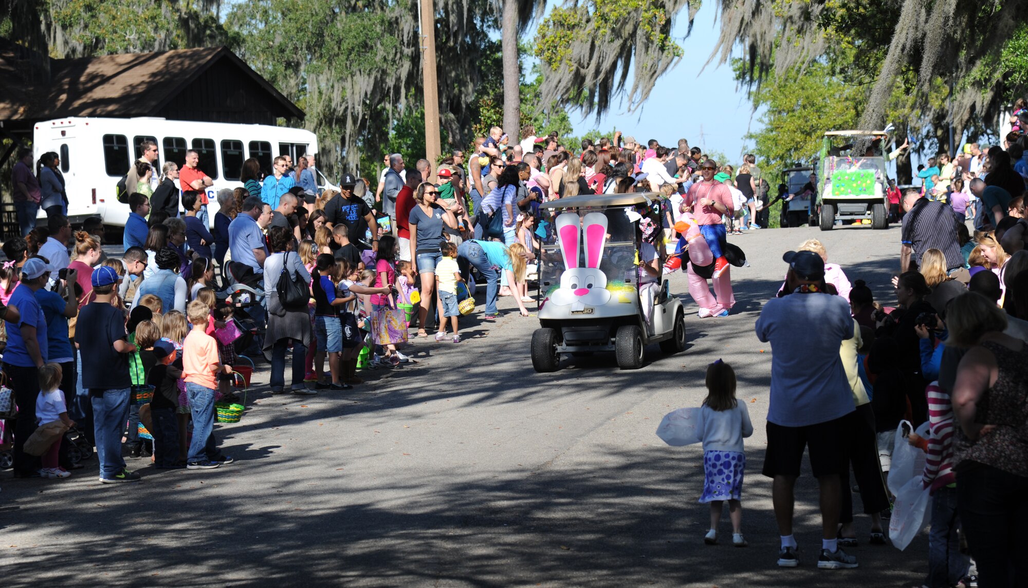 Decorated golf carts roll through the Keesler Marina during an Easter parade April 19, 2014, at Keesler Air Force Base, Miss.  The parade was followed by an Easter egg hunt and the grand opening of the outdoor recreation’s splash pad.  (U.S. Air Force photo by Kemberly Groue)