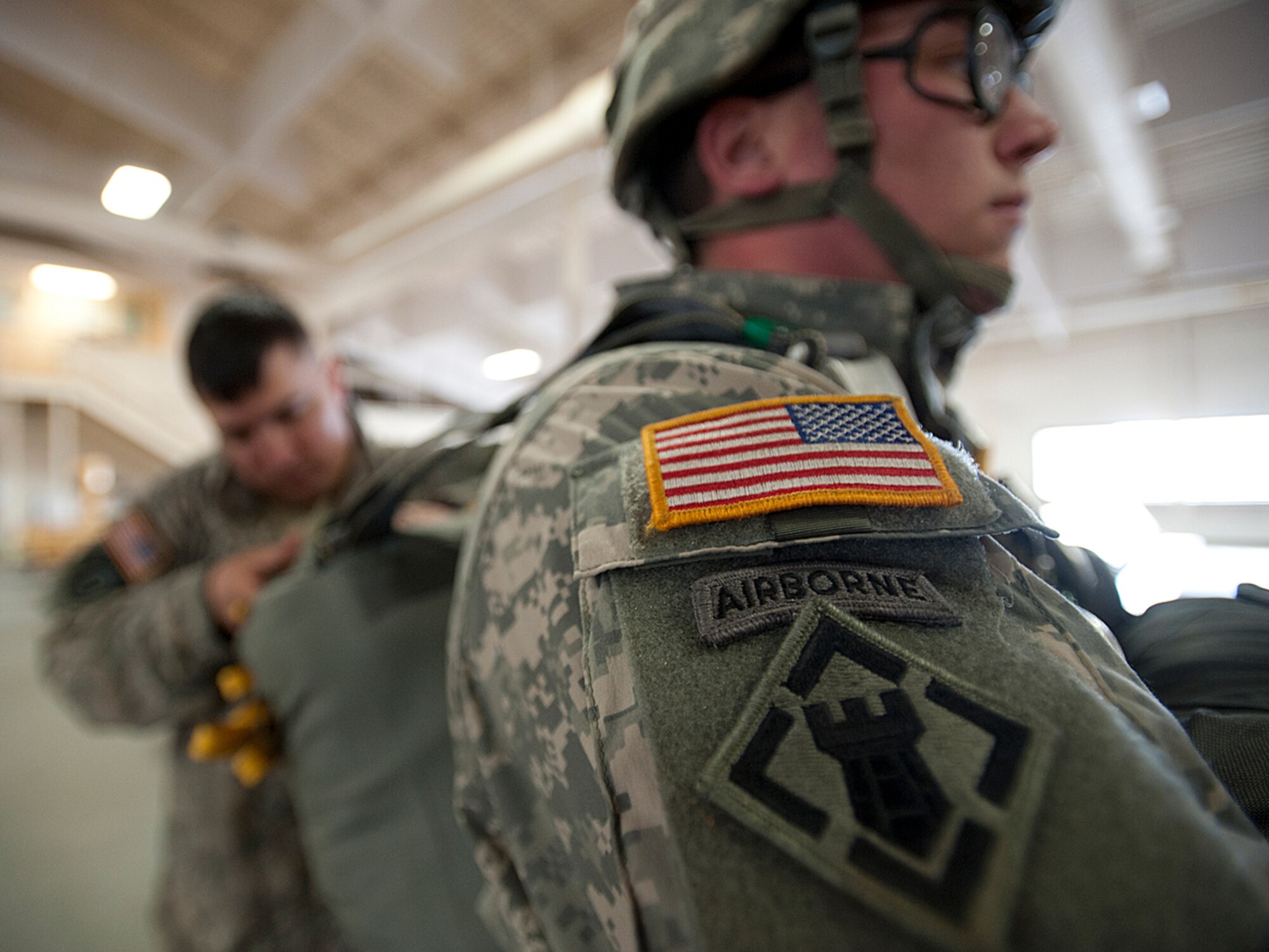 Army 1st Lt. Robert Tester, 84th Engineer Support Company (Airborne), 6th Engineer Battalion (Combat)(Airborne) executive officer and jumpmaster performs a jumpmaster personnel inspection on Spc. Randall Allen, 23rd Engineer Company (Sapper), 6th Engineers, in the Joint Mobility Center at Joint Base Elmendorf-Richardson, Alaska, April 15, 2014. The role of a jumpmaster includes ensuring the jump is safe and parachutes are prepared properly. (U.S. Air Force photo/Staff Sgt. Robert Barnett)