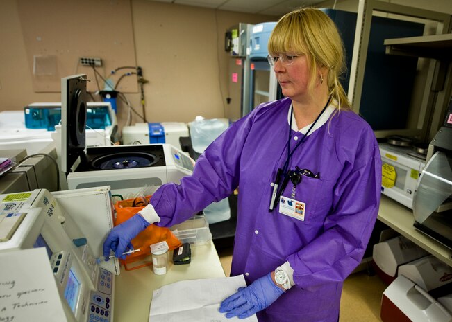 Loretta Sobczak, 99th Medical Support Squadron medical laboratory technician, analyzes a post vasectomy semen specimen, April 14, 2014, at Nellis Air Force Base, Nev. The lab conducts approximately 24 post vasectomy specimen tests per month. The accreditation committee of the College of American Pathologists has awarded accreditation to the Mike O’Callaghan Federal Medical Center. During the accreditation process, inspectors examine the laboratory’s records and quality control procedures for the preceding two years. CAP inspectors also examine laboratory staff qualifications, equipment, facilities, safety program and record and overall management. (U.S. Air Force photo by Senior Airman Jason Couillard)