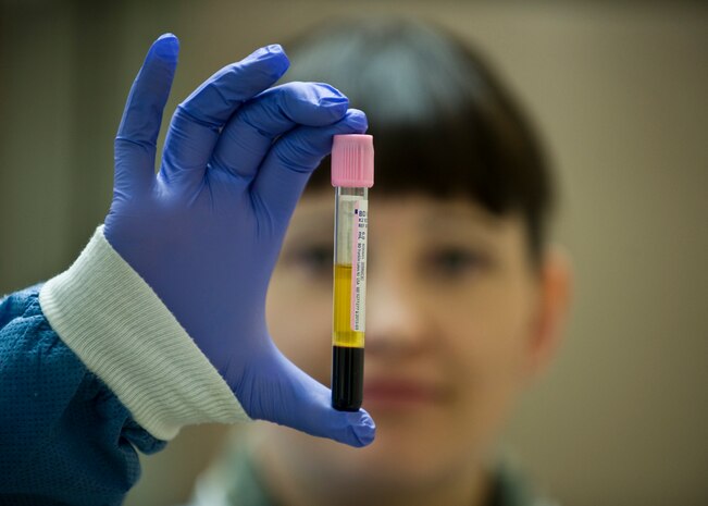 Master Sgt. Sarah Nicolace, 99th Medical Support Squadron lead transfusion services technician, verifies patient information on a sample tube April 14, 2014, at Nellis Air Force Base, Nev. The Mike O’Callaghan Federal Medical Center uses approximately 42 pints of blood per month and takes care of 25 patients per month that receive various blood products. (U.S. Air Force photo by Senior Airman Jason Couillard)