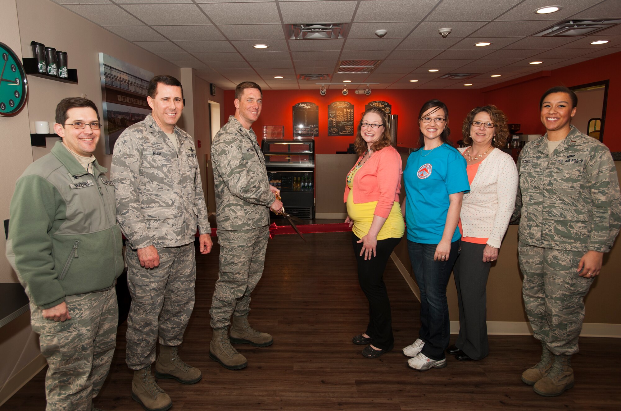 Col. Alex Mezynski, 5th Bomb Wing commander, prepares to cut the ribbon at the B-fifty Brew on Minot Air Force Base, N.D., April 15, 2014. The ribbon-cutting ceremony marked the grand opening of the coffee shop, which was brought to base as a way to boost morale. (U.S. Air Force photo/Airman 1st Class Apryl Hall)