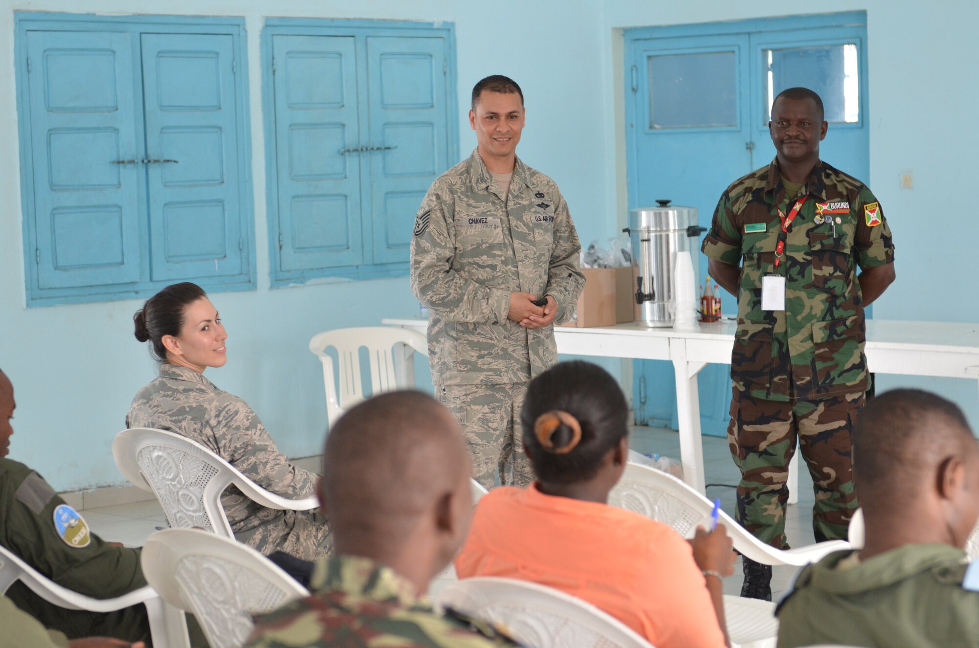 Tech. Sgt. Manuel Chavez, 818th Mobility Support Advisory Squadron air advisor, briefs on cargo preparation side by side a Burundi Airman during Central Accord at Air Base 101, Douala, Cameroon, Mar. 17. (U.S. Army photo by Staff Sgt. Julius Clayton/RELEASED)