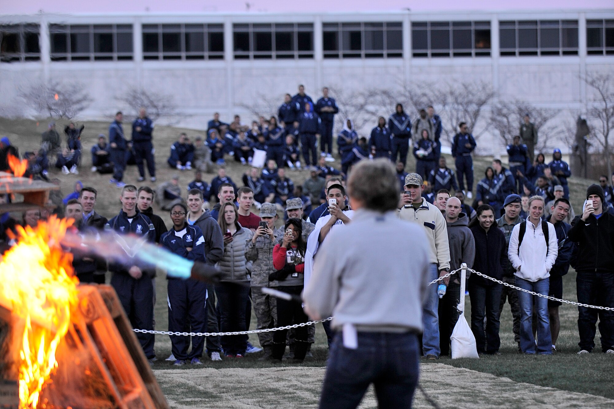Academy Superintendent Lt. Gen. Michelle D. Johnson lights a bonfire in front of the Cadet Wing on the terrazzo here April 17 during "Take Back the night," an event designed to recognize Sexual Assault Awareness Month and affirm the Cadet Wing's culture of respect. (Elizabeth Copan/U.S. Air Force photo)