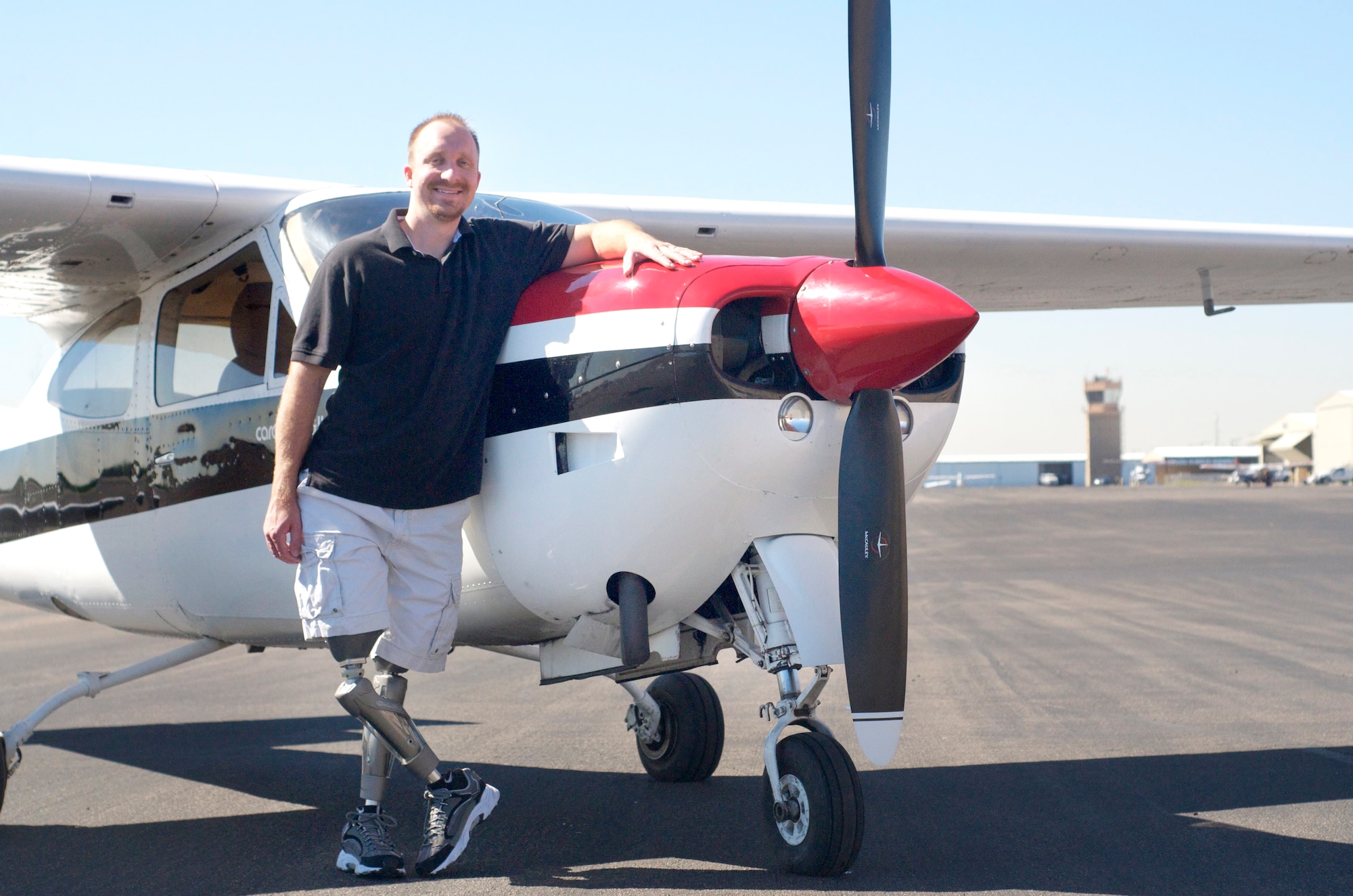 Retired Capt. David Berling, 56th Contracting Squadron contract specialist, stands in front of his 1977 Cessna RG March 23, 2012, at the Glendale Airport. Berling lost his legs in a 2007 plane crash, the subject of which he has written about in a book. (Courtesy photo)