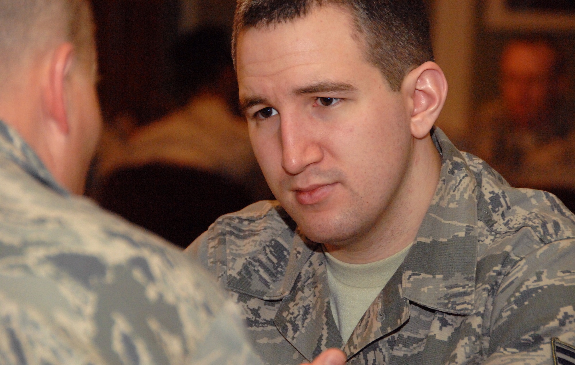 Senior Airman William Warther III discusses career development with U.S. Air Force Maj. James Vickery, USSTRATCOM. Warther was one of 60 Airmen who met with senior leaders as part of a speed-mentoring session put on by the Offutt Elite Four professional organization April 15, 2014 at Offutt Air Force Base, Neb. (U.S. Air Force Photo/Delanie Stafford)