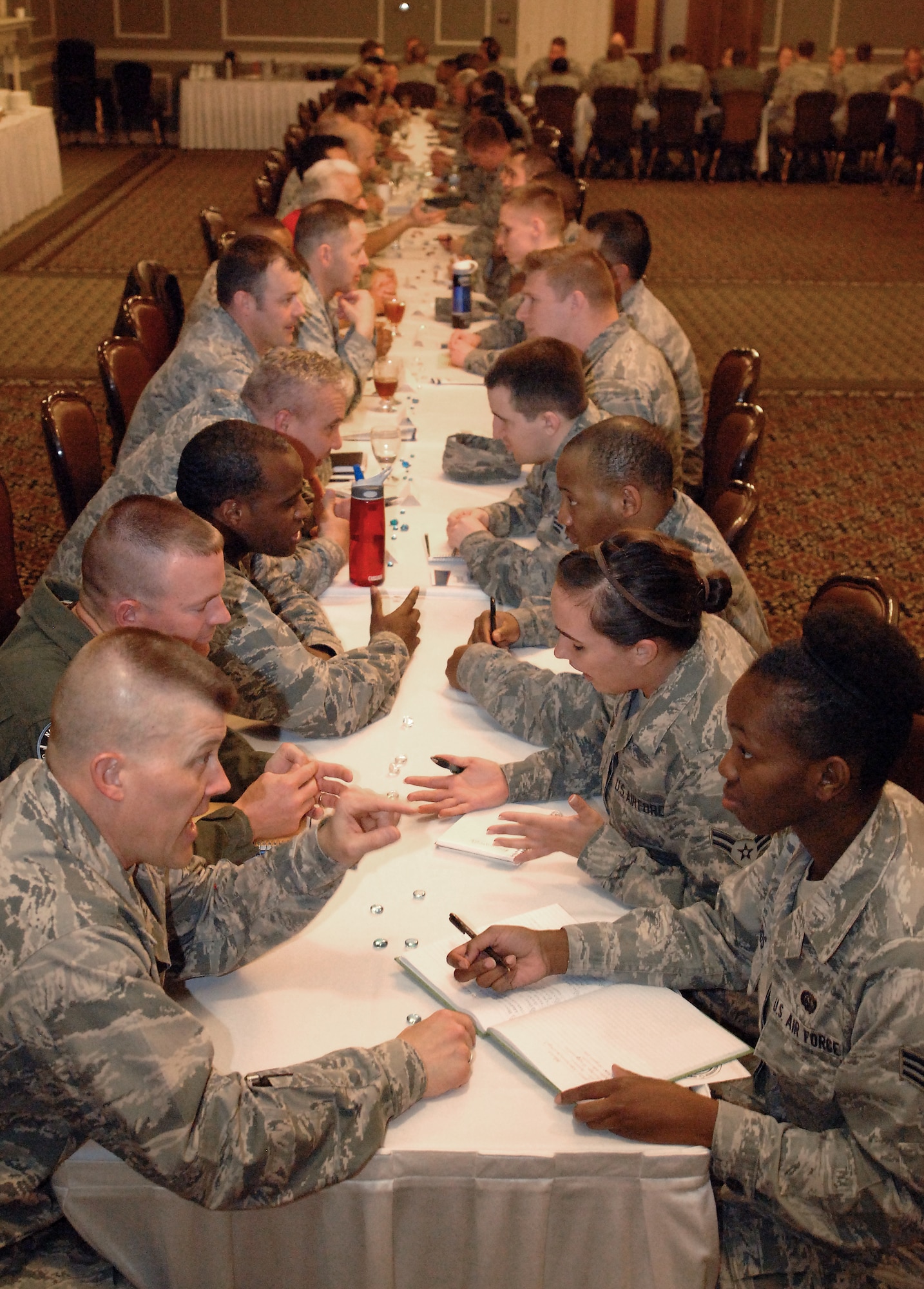 Airmen from various Offutt units meet with mentors as part of a speed-mentoring session held April 15, 2014 at Offutt Air Force Base, Neb. The event was coordinated by the Offutt Elite Four professional organization, and provided an opportunity for Airmen to meet with multiple senior enlisted members and officers to discuss career development. (U.S. Air Force Photo/Delanie Stafford)
