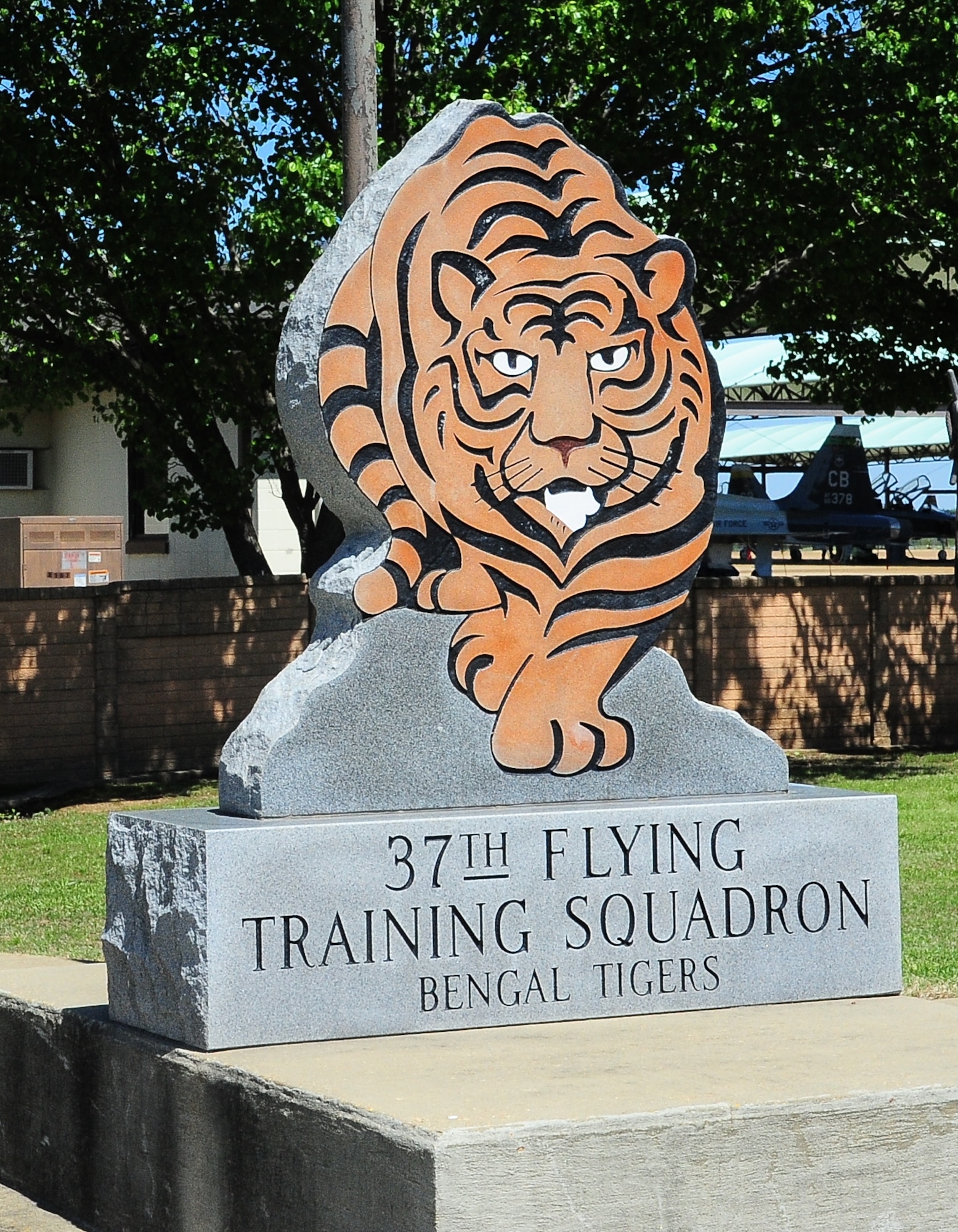 A statue of the 37th Flying Training Squadron’s Bengal Tiger mascot is displayed just outside their doors at Columbus Air Force Base, Miss., April 16, 2014. Before arriving at the 37 FTS, pilots must train through Initial Flight Screening program where they learn the basic principles of flying, although they still have very little actual flight experience by the time they arrive. (U.S. Air Force photo by Senior Airman Kaleb Snay)