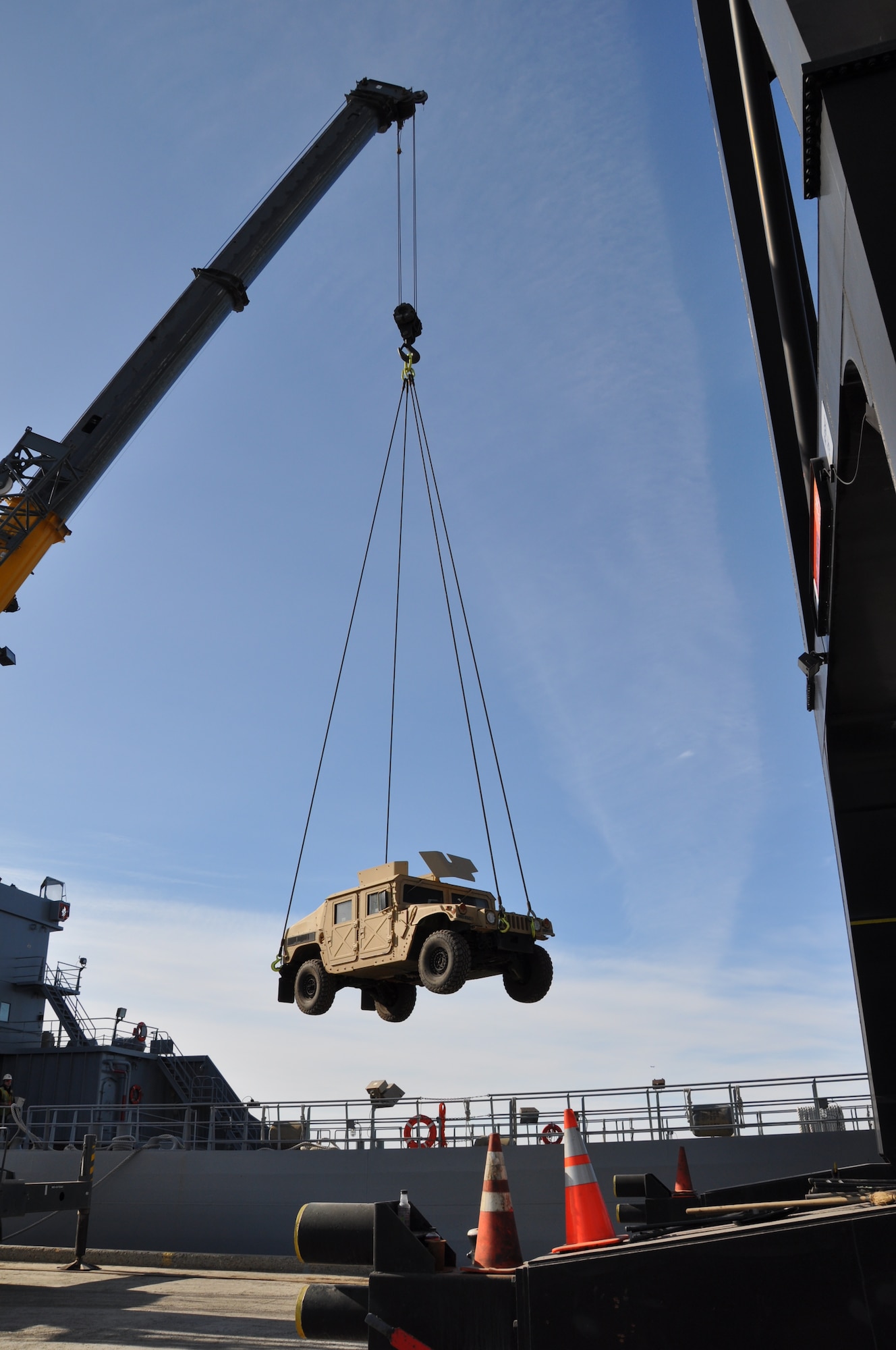 Soldiers from 7th Transportation Brigade (Expeditionary) unload a 593rd Expeditionary Sustainment Command vehicle from Logistics Support Vessel 7 during Joint Logistics Over-the-Shore operations as part of Alaska Shield 14 in Anchorage, Alaska, March 31, 2014.  Key capabilities in the exercise included establishing and managing port operations, fuel transfer, storage capabilities, receiving large cargo vessels and transferring supplies to port. (U.S. Army photo by Sgt. Stefanie D. Warner/Released)