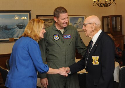 Kim Rand and Gen. Robin Rand, Air Education and Training Command commander, greet retired Lt. Col. Richard Cole, co-pilot of Aircraft No. 1 of the Doolittle Tokyo Raid, at the Joint Base San Antonio-Randolph Parr Club.  Cole was honored during the 72nd anniversary celebration of the Doolittle Tokyo Raid of April 18, 1942.  Cole is one of four remaining survivors of the mission. (U.S. Air Force photo by Melissa Peterson)