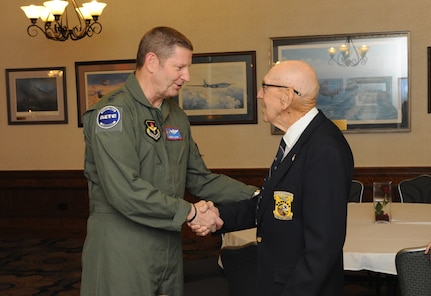 Gen. Robin Rand, Air Education and Training Command commander, shakes hands with retired Lt. Col. Richard Cole, co-pilot of Aircraft No. 1 of the Doolittle Toyko Raid. Cole was honored during the 72nd anniversary celebration of the Doolittle Tokyo Raid of April 18, 1942.  Cole is one of four remaining survivors of the mission. (U.S. Air Force photo by Melissa Peterson)