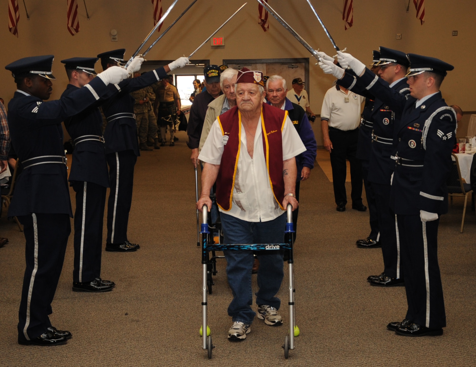 Barksdale Honor Guard members present a sword cordon for veterans during the 36th Annual Veterans, Prisoner of War, Missing in Action and Purple Heart Luncheon on Barksdale Air Force Base, La., April 18, 2014. More than 83,000 Americans are missing from World War II, the Korean War, Cold War, Vietnam War and the 1991 Gulf War. (U.S. Air Force photo/Staff Sgt. Sean Martin)