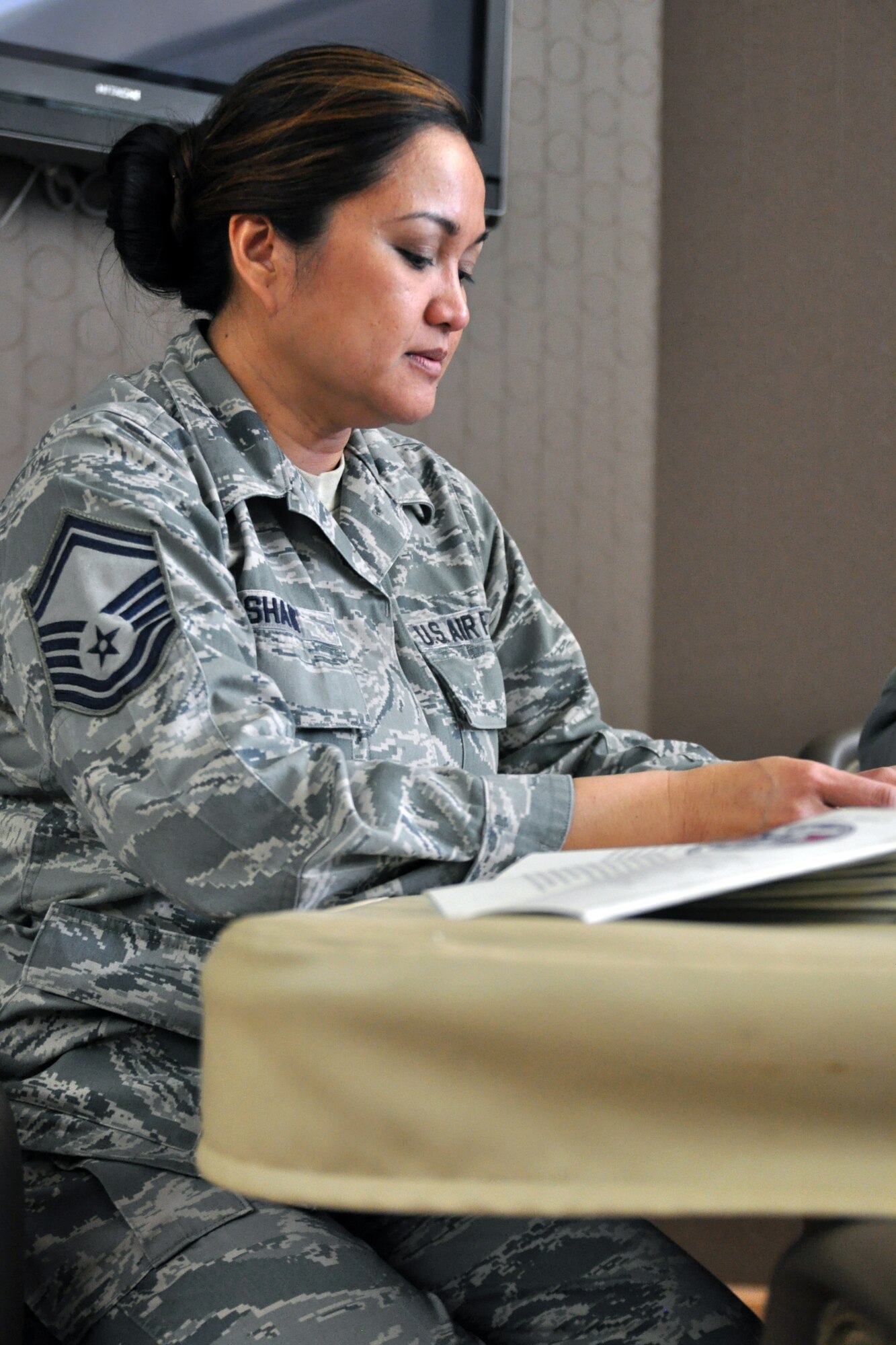 U.S. Air Force Reserve Senior Master Sgt. Joann G. Shaw, Reserve Recruiting flight chief assigned to the 910th Airlift and president of the Top 3 Council, looks over notes for a council meeting here, Ohio, April 5, 2014. The purpose of the Top 3 Council is to provide mentorship and cultivate a sense of belonging, camaraderie and recognition. U.S. Air Force photo/Tech. Sgt. Valerie Smock.