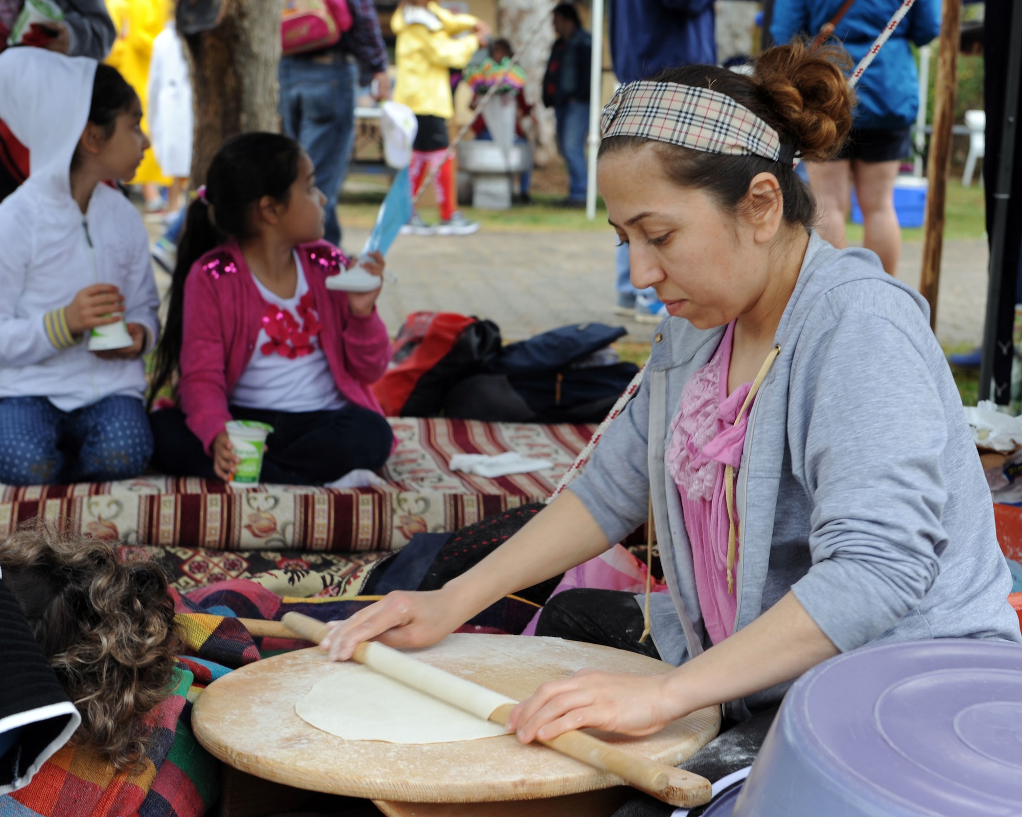 Teslime Sengul, a Turkish citizen, rolls dough to make sikma at the Spring Fling and Children’s Day event April 19, 2013 at Incirlik Air Base, Turkey. Sikma is a Turkish wrap often made with freshly baked bread and eaten with a cold yogurt-like drink called ayran. (U.S. Air Force photo by Senior Airman Chase Hedrick, 39th Air Base Wing Public Affairs)